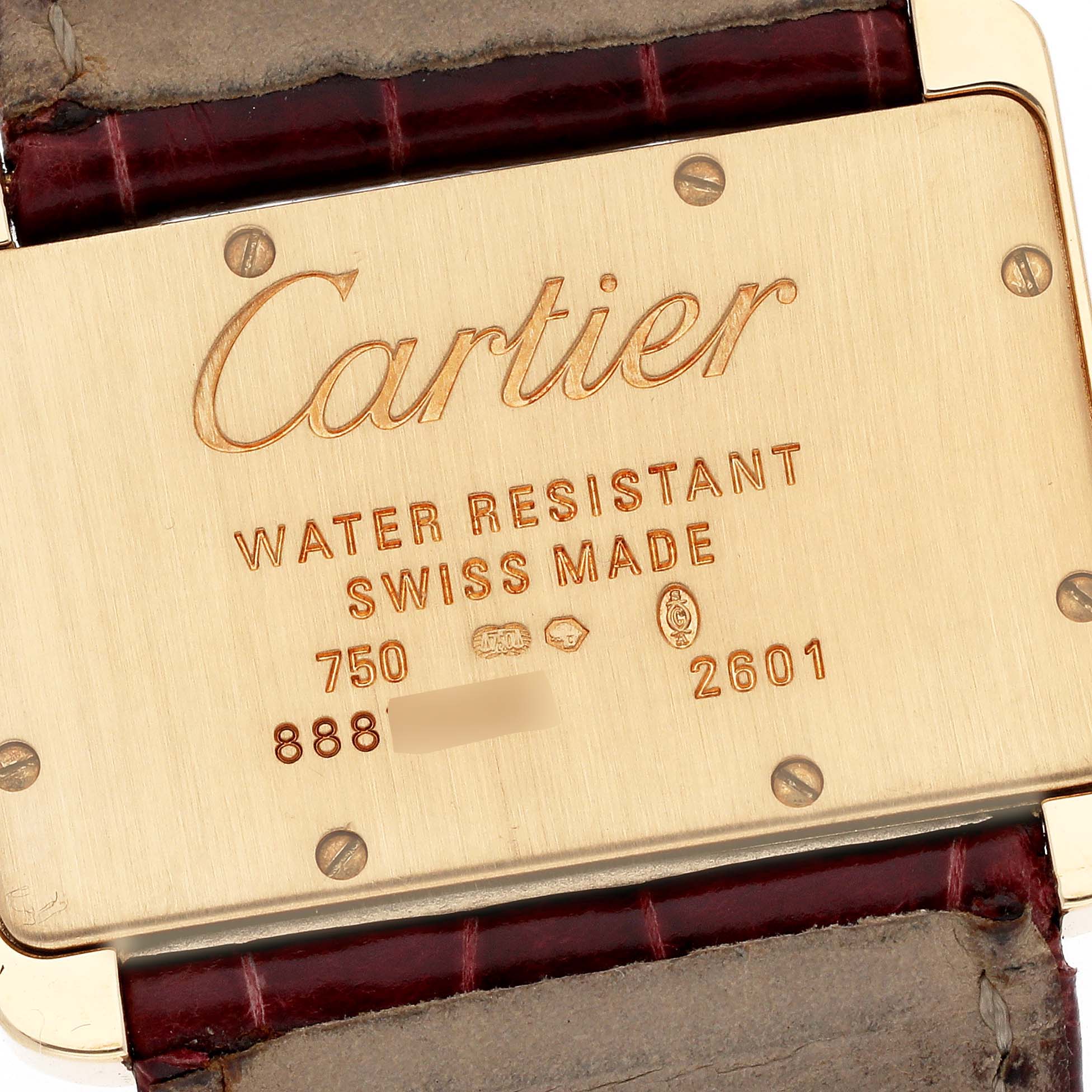 The image shows the back plate of a Cartier Tank Divan W6300356 Women's Yellow Gold Silver Dial W6300356 Women's Yellow Gold Silver Dial watch, highlighting its markings and leather strap.