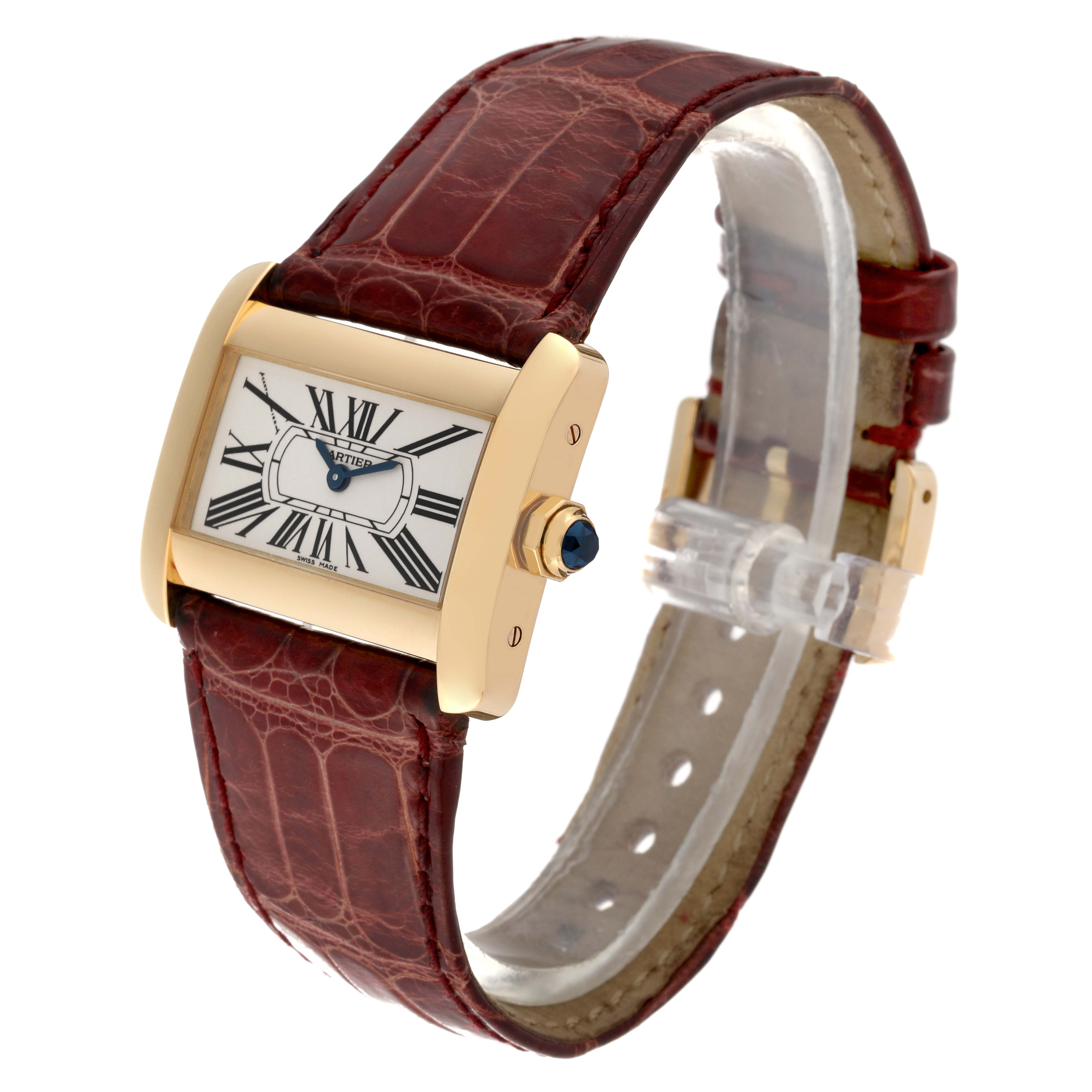 The Cartier Tank Divan W6300356 Women's Yellow Gold Silver Dial W6300356 Women's Yellow Gold Silver Dial watch is shown at a three-quarter angle, displaying its brown leather strap, rectangular face, and gold casing.
