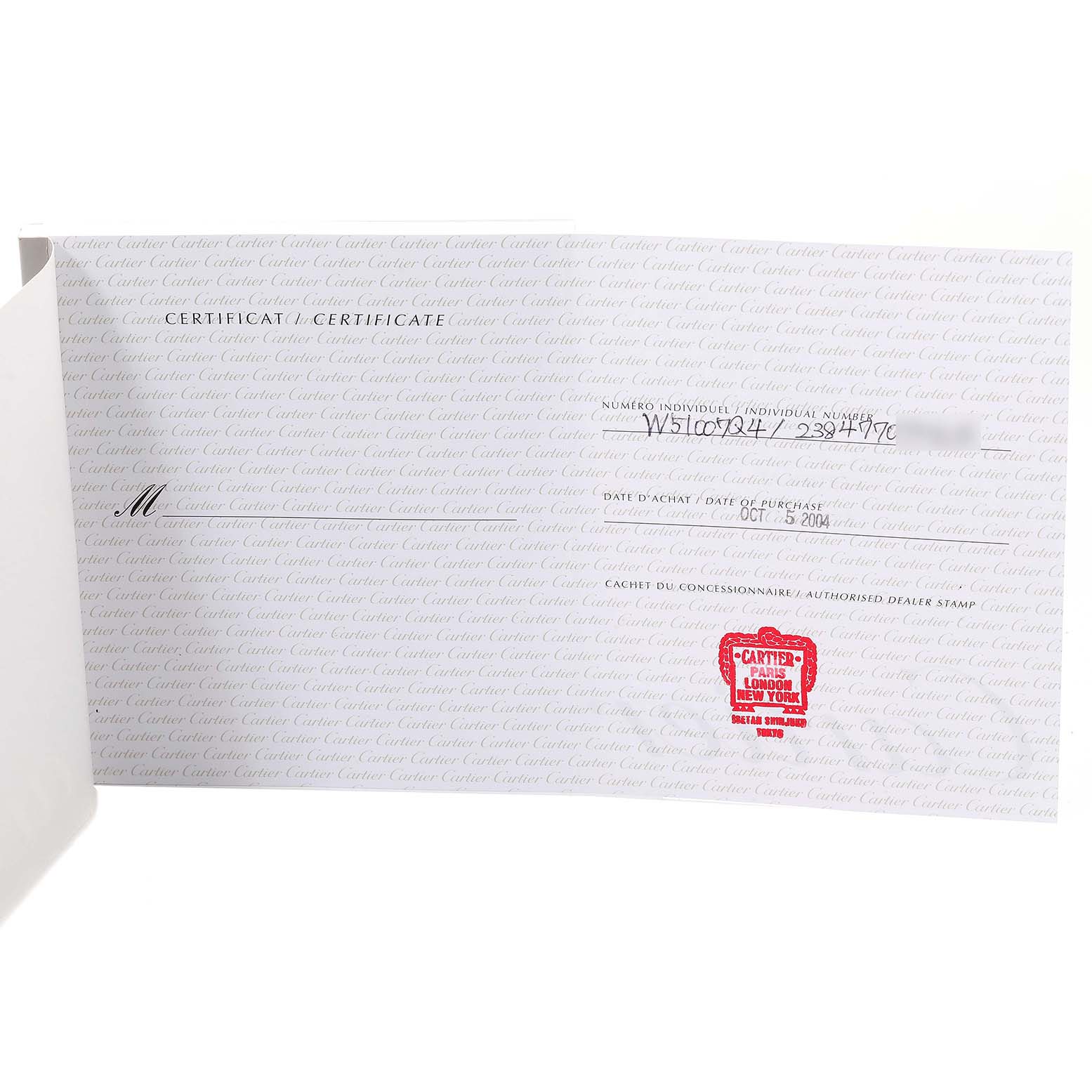 The image shows a warranty certificate for a Cartier Tank Française watch, featuring text and a red authorized dealer stamp.