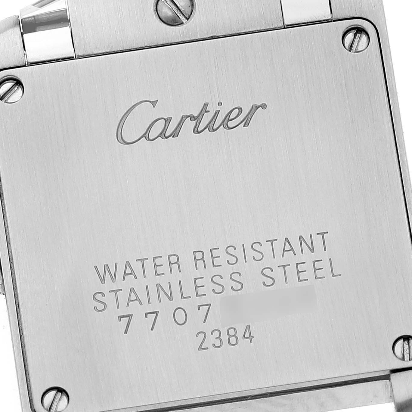 This image shows a close-up of the back case of a Cartier Tank Francaise W51007Q4 Women's Steel and Gold (two tone) Silver Dial W51007Q4 Women's Steel and Gold (two tone) Silver Dial watch, displaying the brand name and specifications.