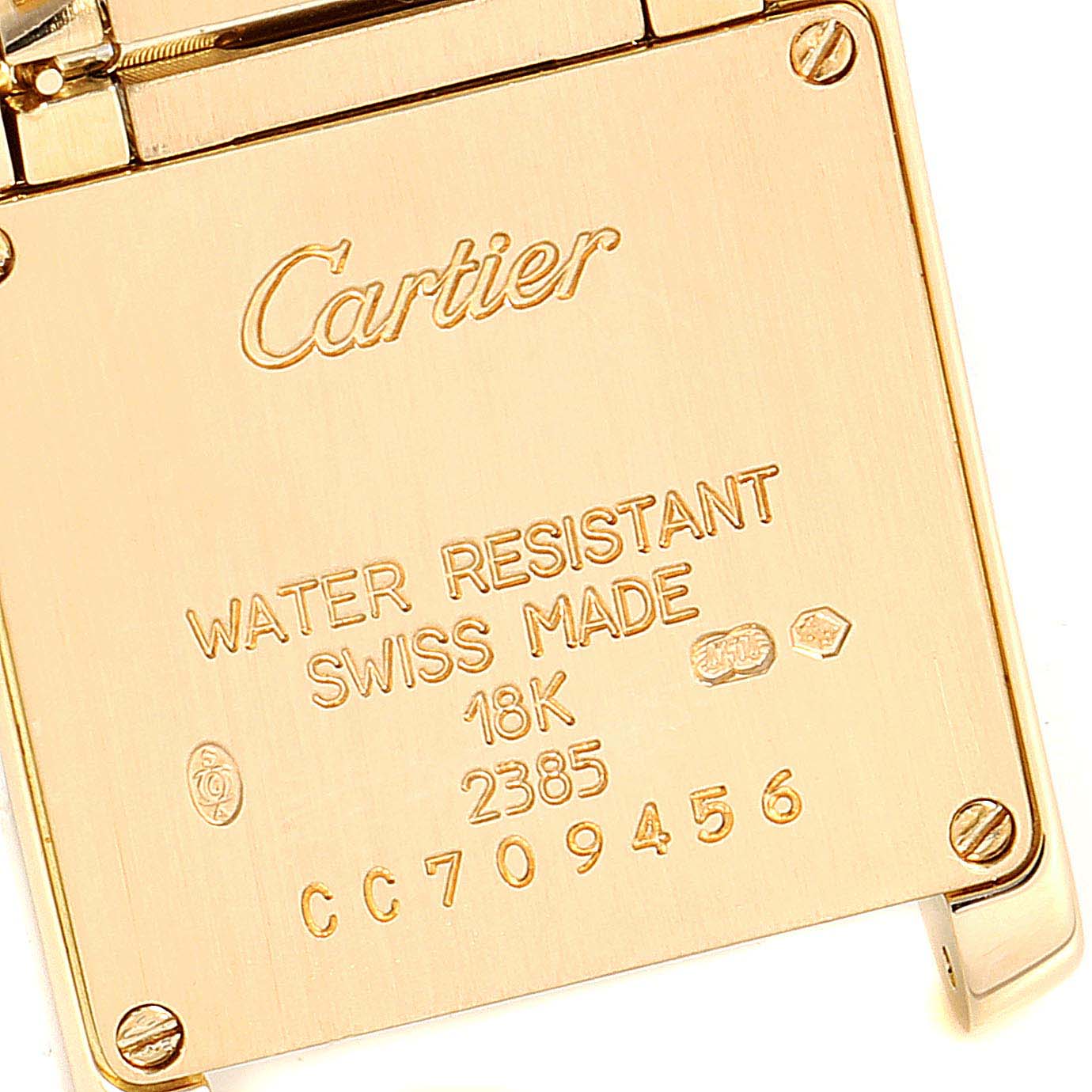This image shows the back plate of a Cartier Tank Francaise W50002N2 Women's Yellow Gold Silver Dial W50002N2 Women's Yellow Gold Silver Dial watch, with water resistance and 18K markings.