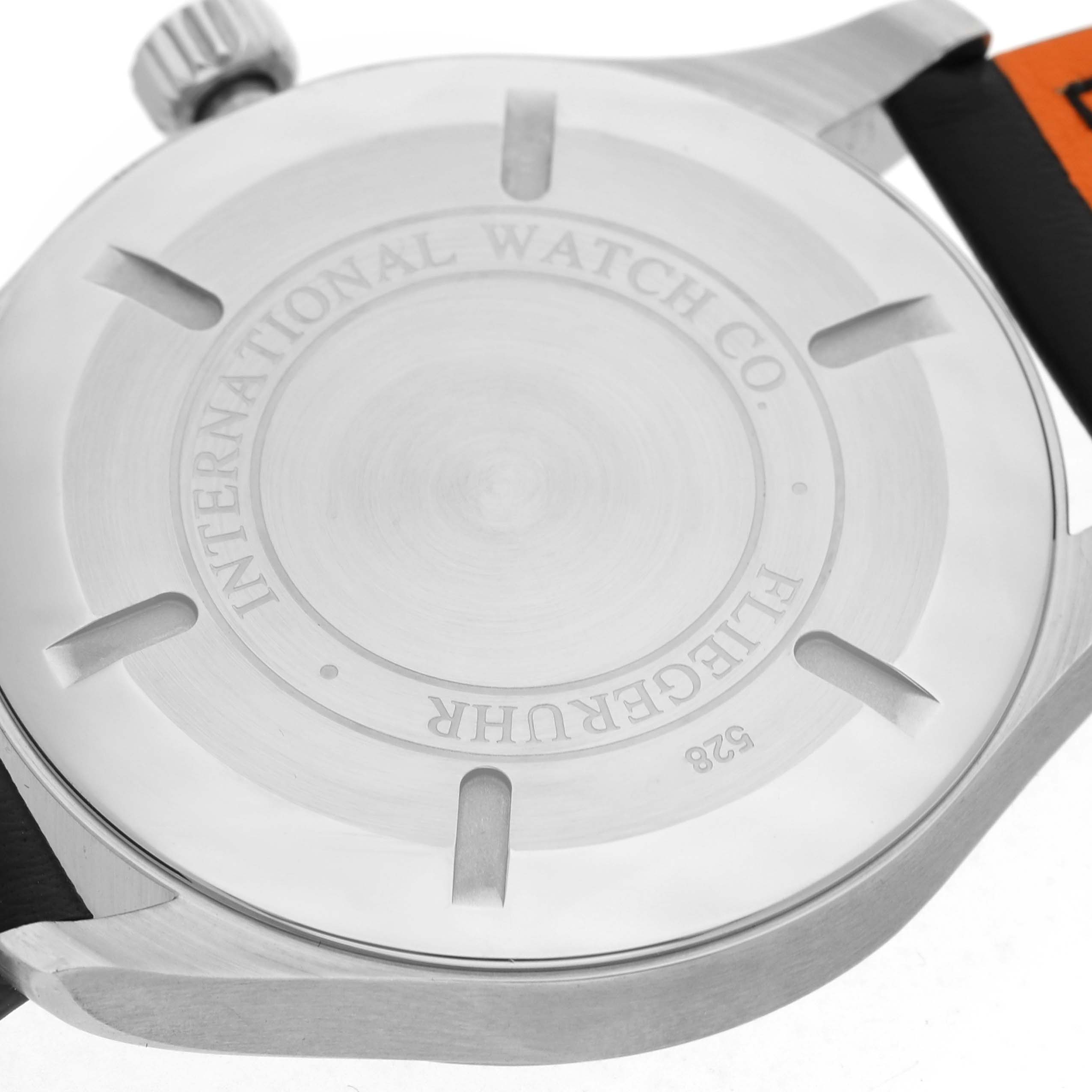 The image shows the back case of an IWC Pilot IW326501 Men's Stainless Steel Black Dial watch, highlighting the engraving details.