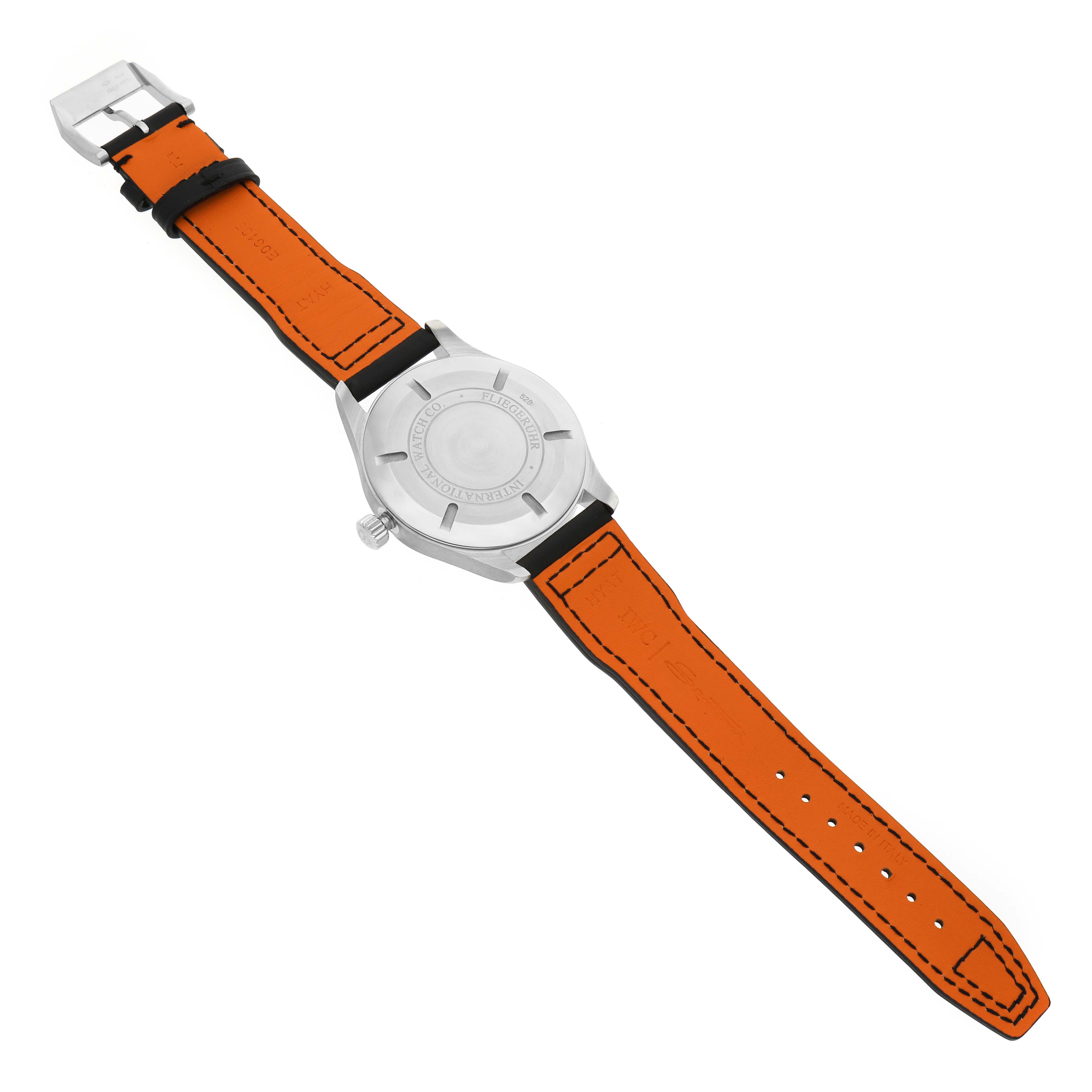The image shows the back of an IWC Pilot IW326501 Men's Stainless Steel Black Dial watch, featuring the case back and orange strap laid flat.