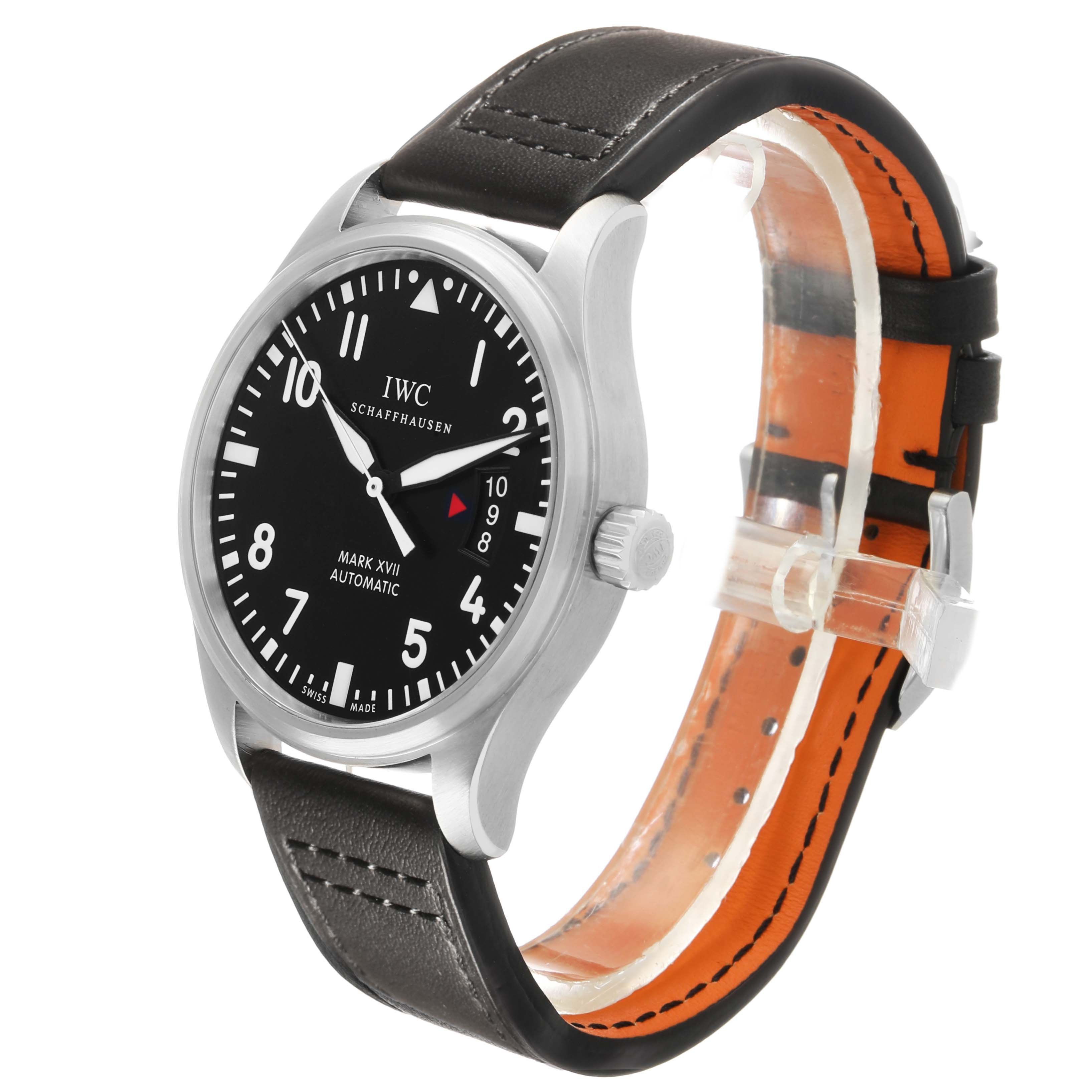 The image shows an IWC Pilot IW326501 Men's Stainless Steel Black Dial Mark XVII watch at a three-quarter angle, highlighting the black dial, numerals, crown, and leather strap.