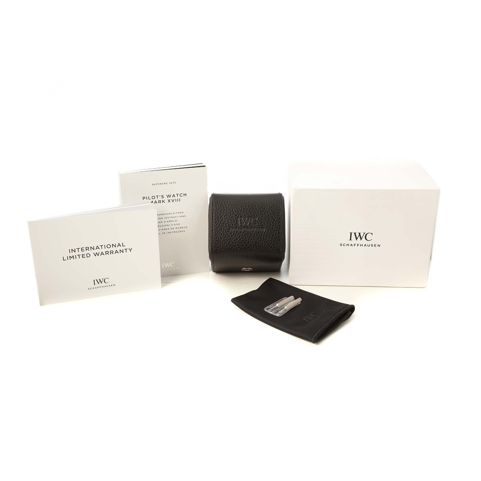 The IWC Pilot IW327015 Men's Stainless Steel Black Dial model's accessories include a box, pouch, case, extra spring bars, and documentation displayed from the front.