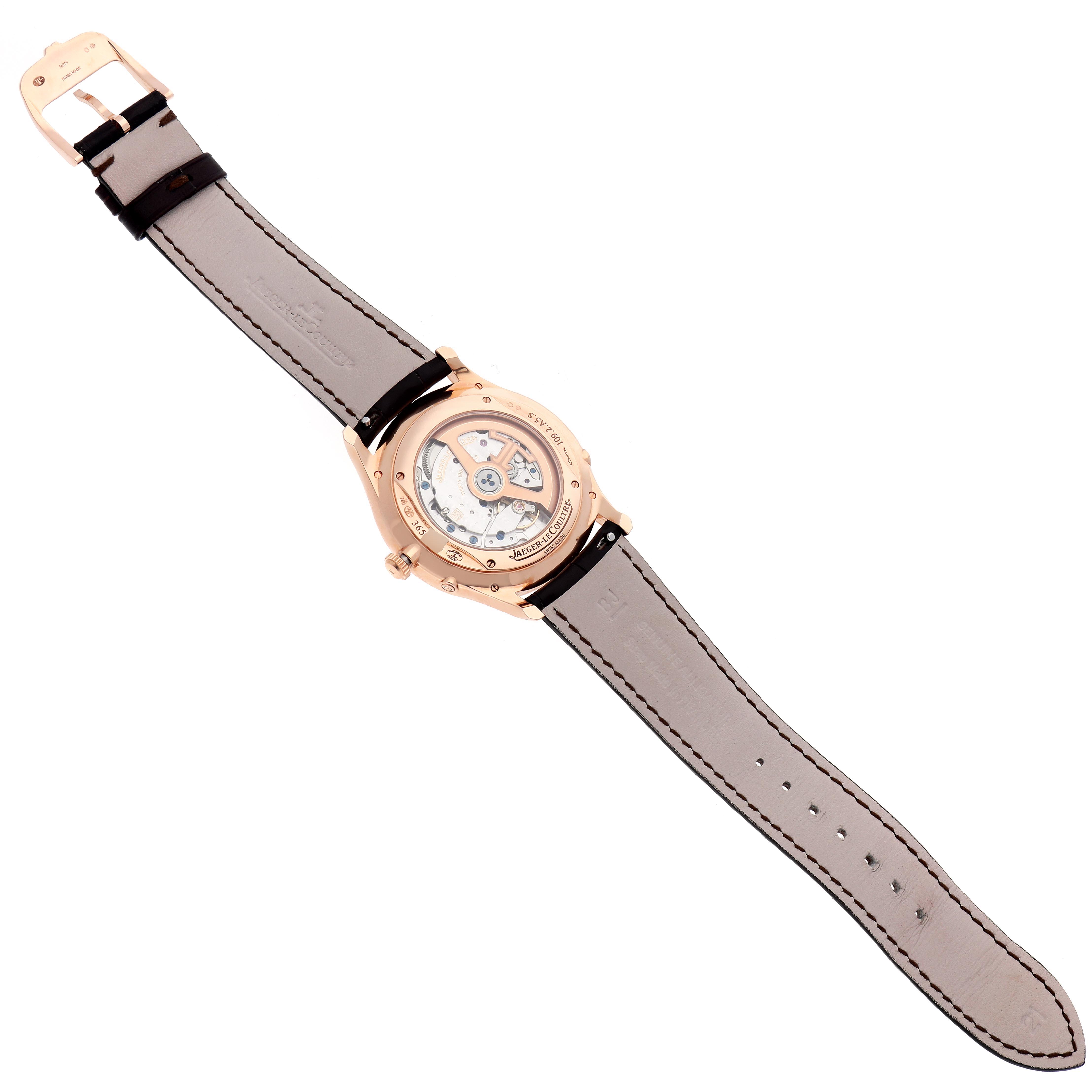 The Jaeger LeCoultre Master Q1362510 Men
s Rose Gold Beige Dial Q1362510 Men
s Rose Gold Beige Dial watch is shown from the back, displaying its transparent case back and mechanical movement.