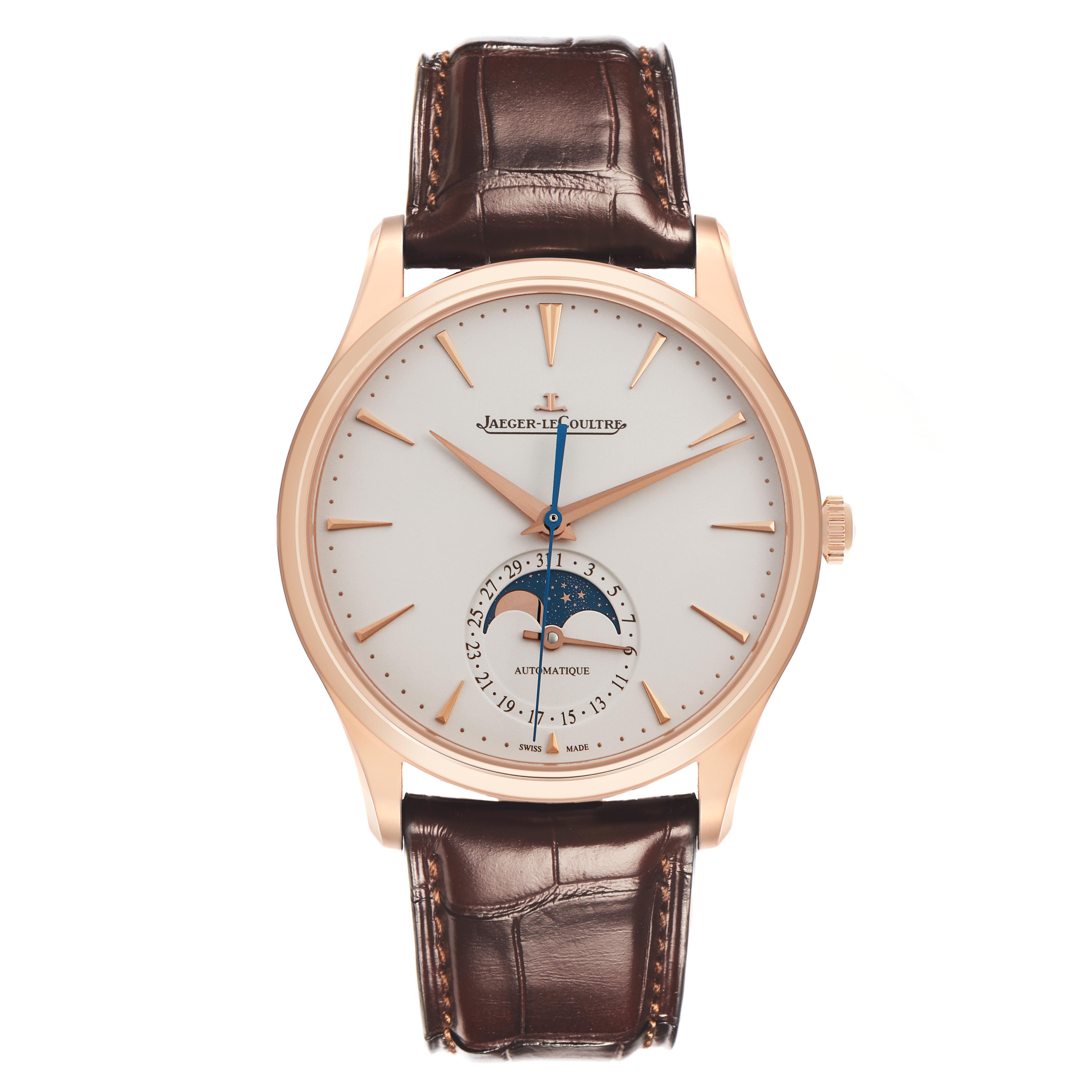 The Jaeger LeCoultre Master Q1362510 Men
s Rose Gold Beige Dial Q1362510 Men
s Rose Gold Beige Dial watch is shown from the front, displaying the dial, moon phase, and date functions with a brown strap.