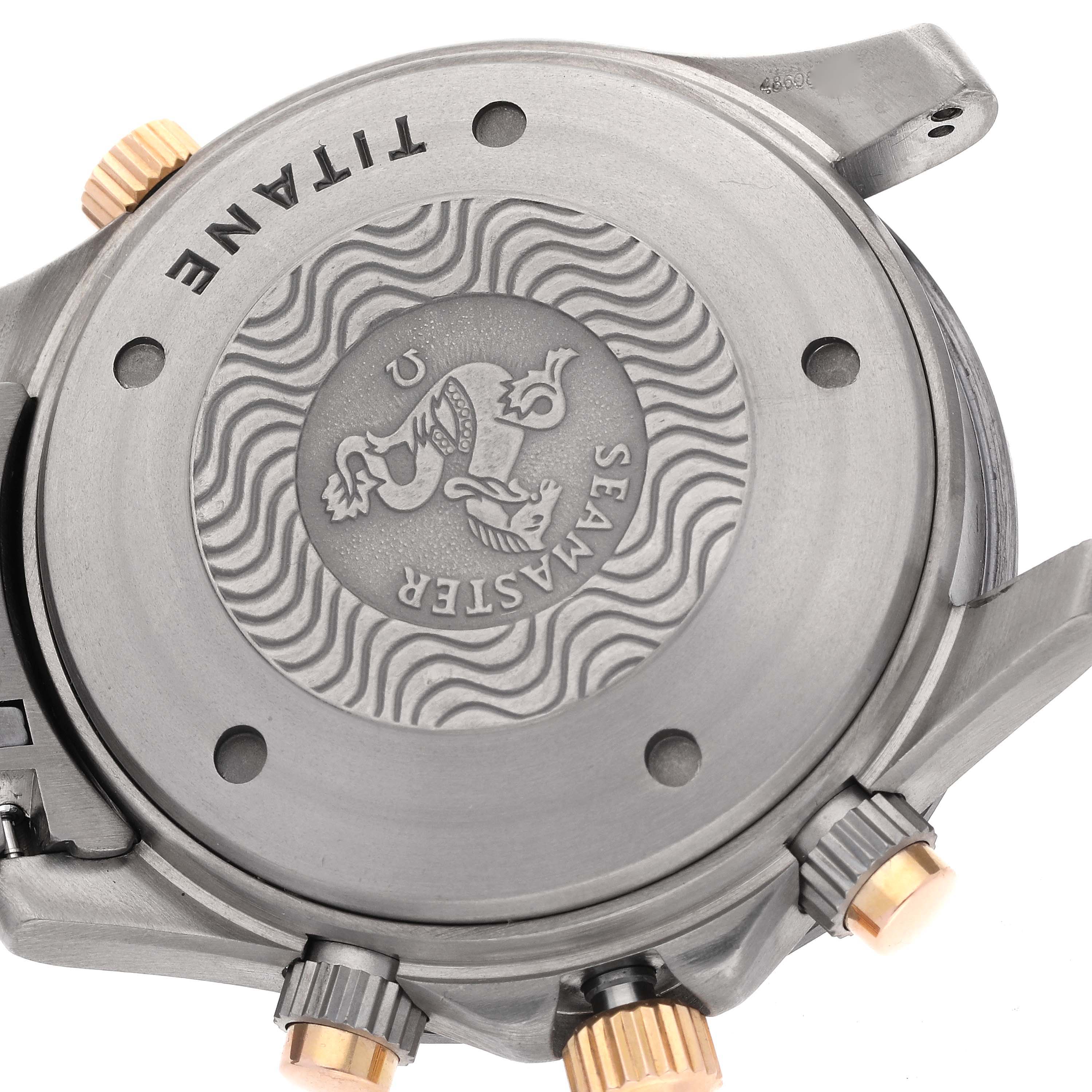 The image shows the backside of an Omega Seamaster 2296.80.00 Men
s Titanium Blue Dial 2296.80.00 Men
s Titanium Blue Dial watch, focusing on its case back and crown.