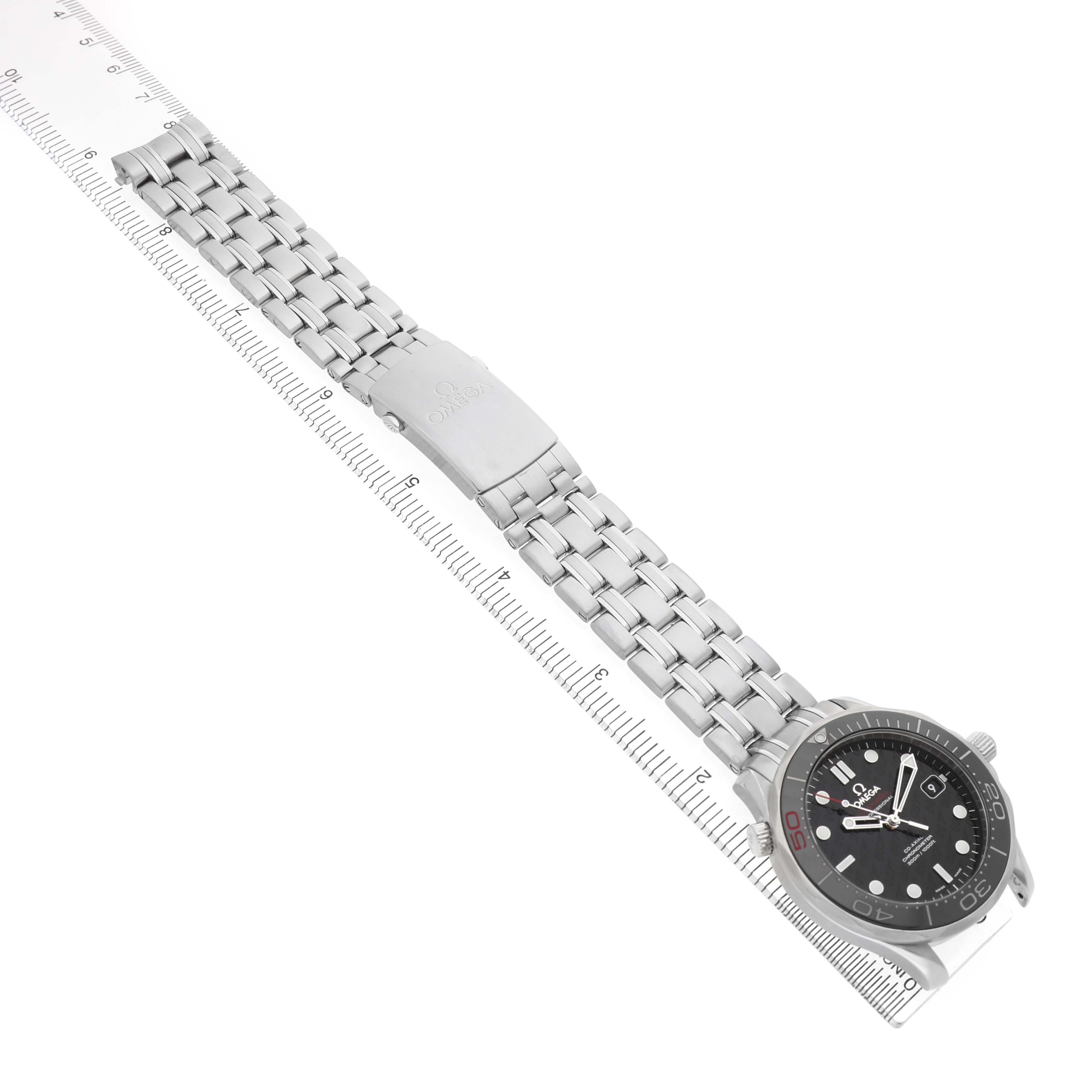 The Omega Seamaster 212.30.41.20.01.005 Men's Stainless Steel Black Dial watch is shown from an angled top view, displaying the bracelet, clasp, and face alongside a ruler.