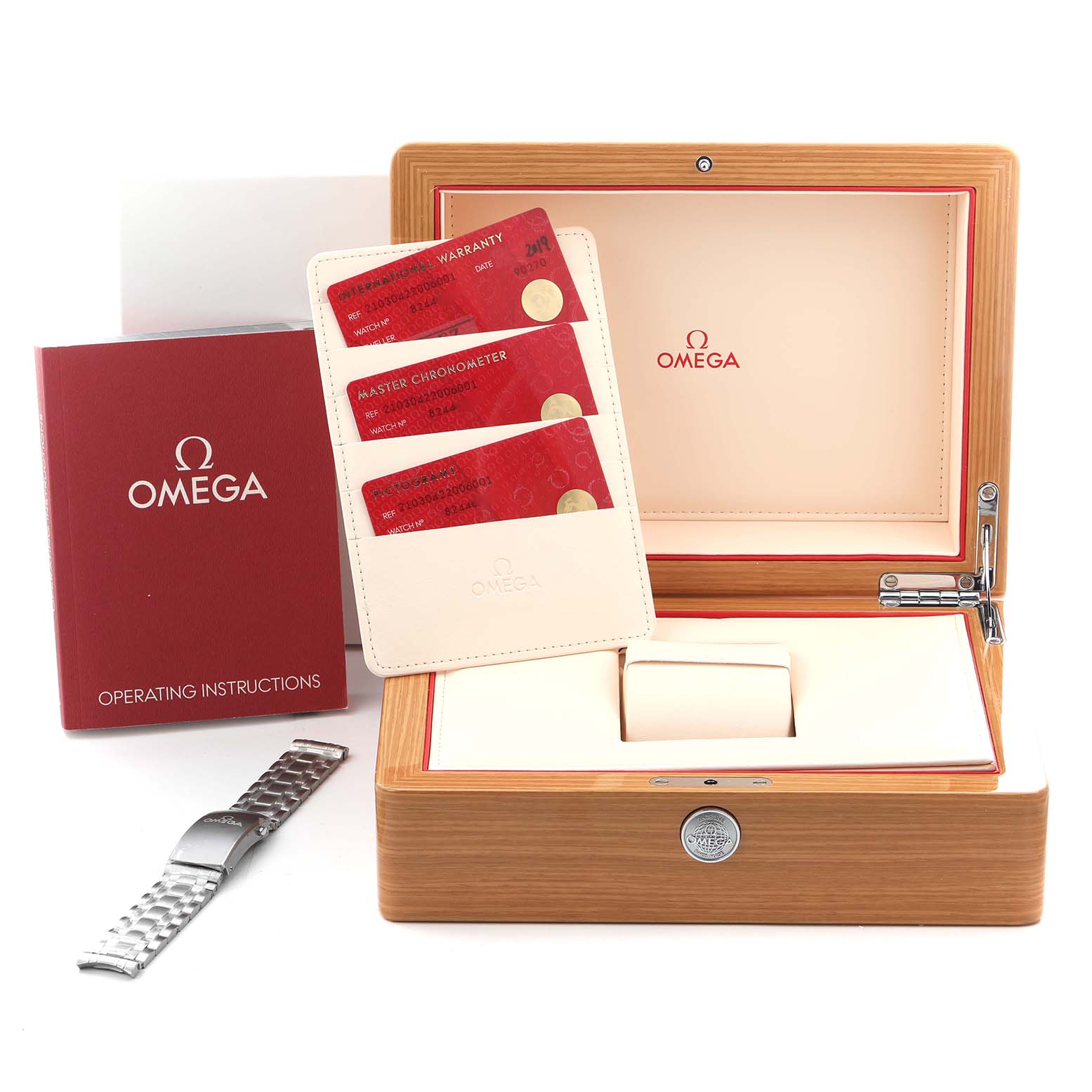 The image shows the Omega Seamaster 210.30.42.20.06.001 Men
s Stainless Steel Grey Dial 210.30.42.20.06.001 Men
s Stainless Steel Grey Dial watch accessories, including its box, warranty cards, operating instructions, and a metal bracelet, viewed from above.