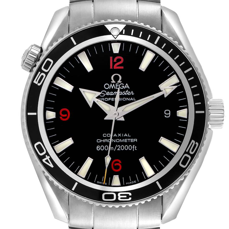 The Omega Planet Ocean watch is shown from a front angle, displaying the bezel, dial, hands, and part of the strap.