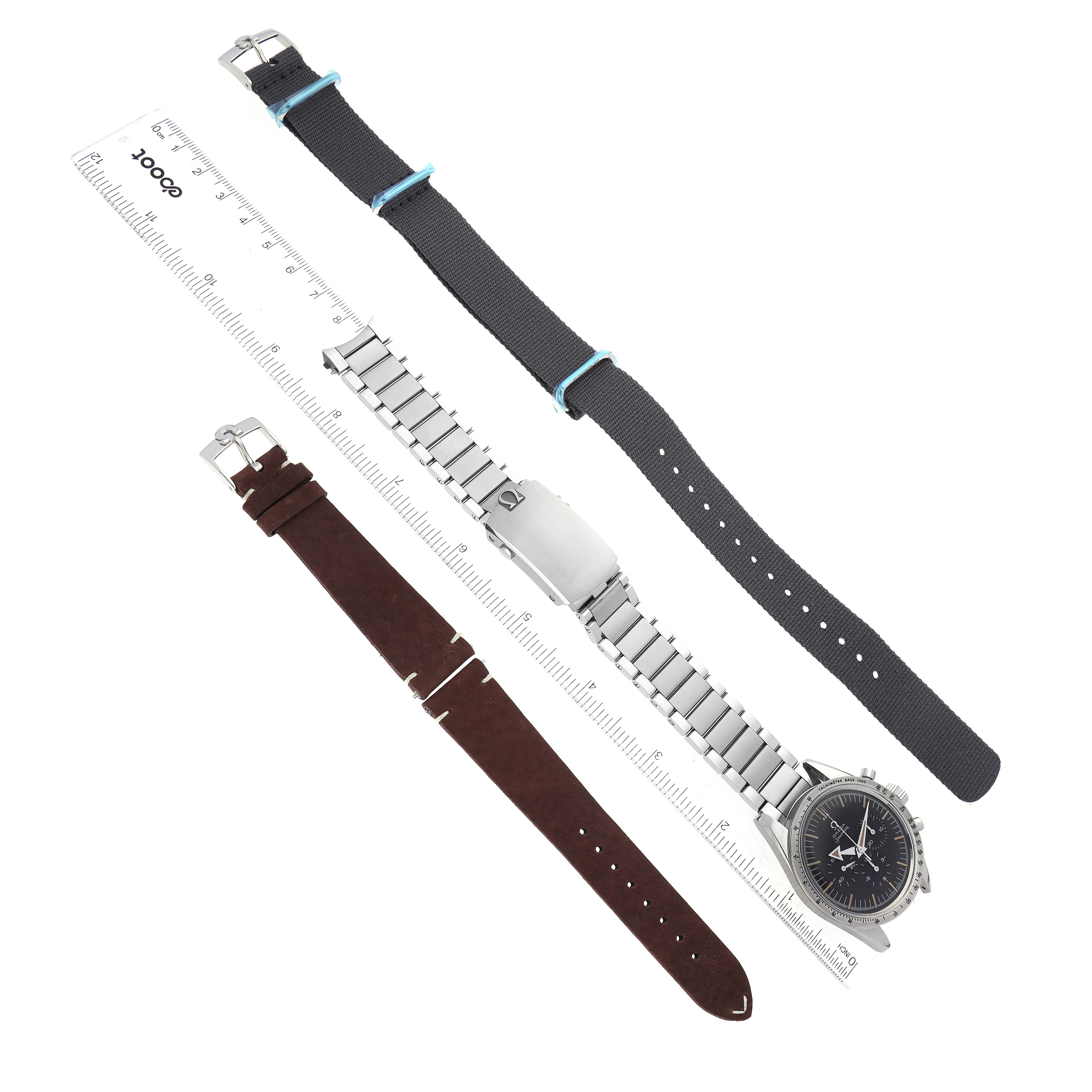 The image shows an Omega Speedmaster 311.10.39.30.01.001 Men's Stainless Steel Black Dial 311.10.39.30.01.001 Men's Stainless Steel Black Dial watch with its metal bracelet attached and two separate watch bands, one brown leather and one black fabric.