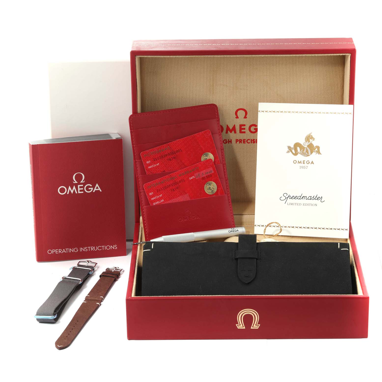 The image shows an Omega Speedmaster 311.10.39.30.01.001 Men's Stainless Steel Black Dial 311.10.39.30.01.001 Men's Stainless Steel Black Dial watch box with instructional booklets, warranty cards, straps, and a tool.