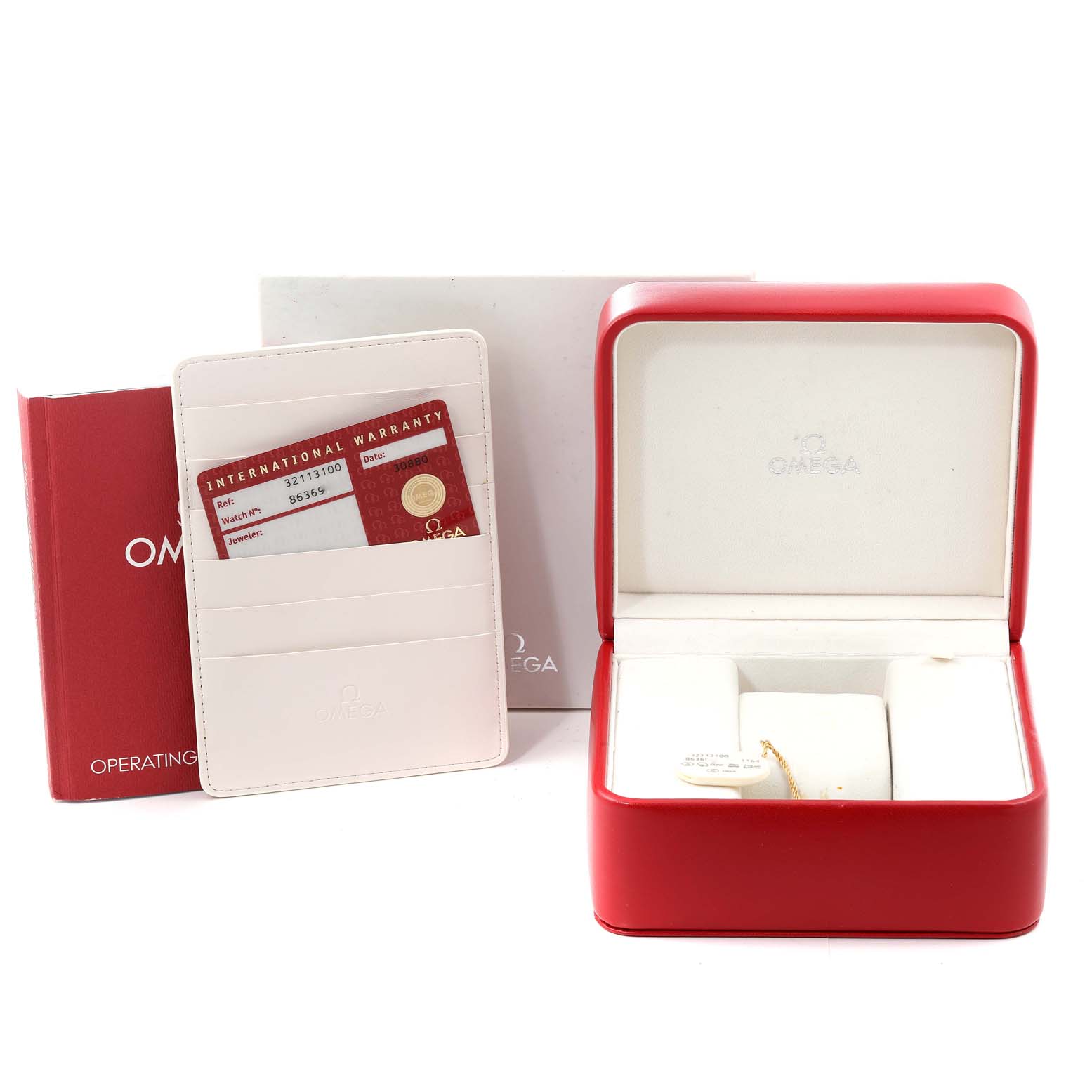 The image shows the box, warranty card, and operating instructions for an Omega Speedmaster 3211.31.00 Men's Stainless Steel Silver Dial 3211.31.00 Men's Stainless Steel Silver Dial watch.