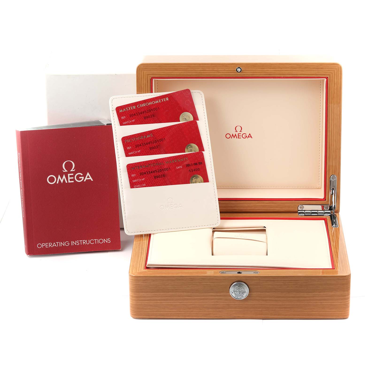The image shows an Omega Speedmaster 304.33.44.52.01.001 Men's Stainless Steel Black Dial watch box, warranty cards, and an operating instructions booklet from a frontal angle.