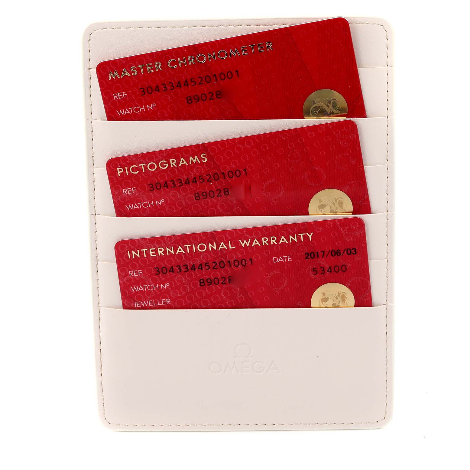 The image shows warranty and certification cards for the Omega Speedmaster 304.33.44.52.01.001 Men's Stainless Steel Black Dial, displayed in a white card holder.