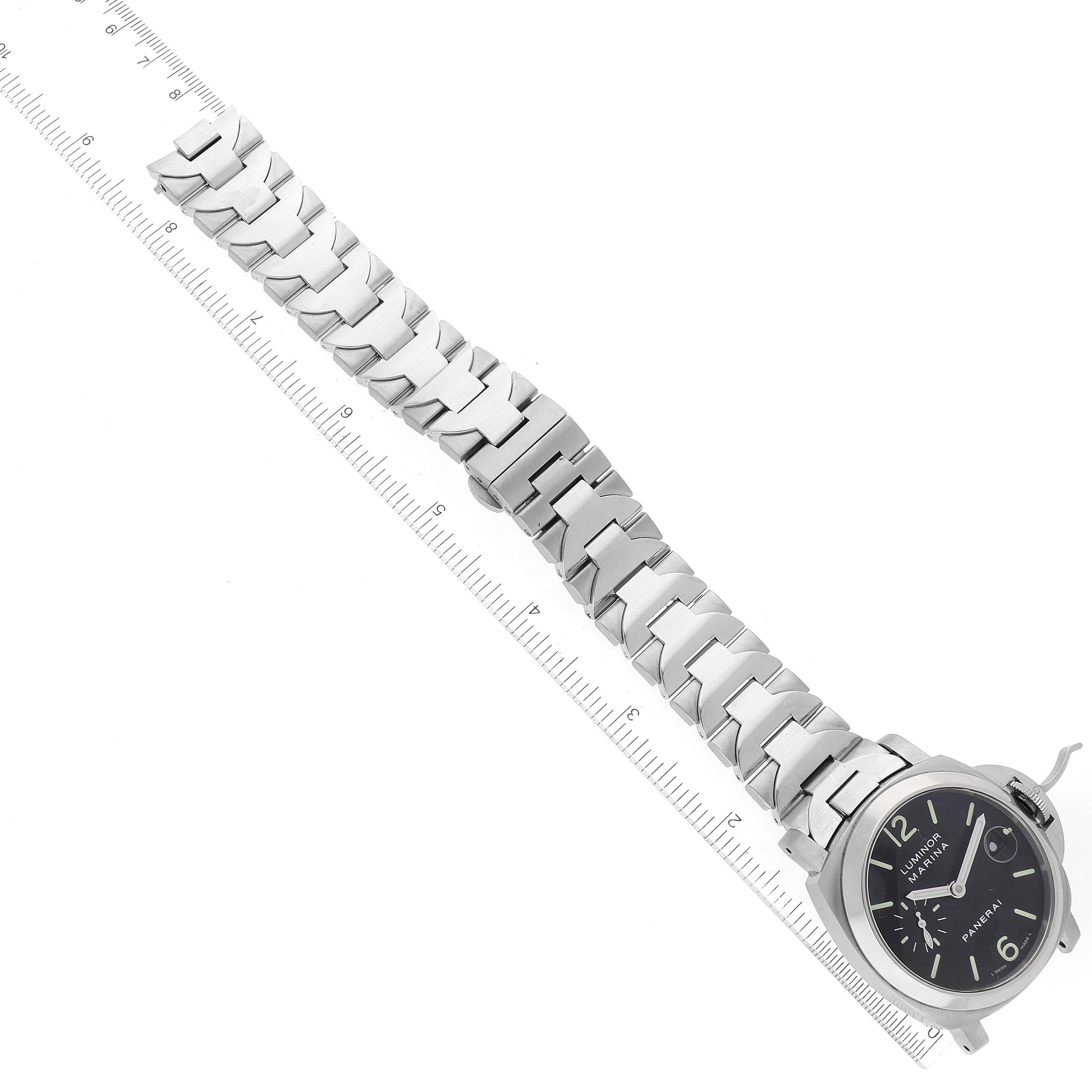 The image shows a Panerai Luminor PAM00050 Men's Stainless Steel Black Dial PAM00050 Men's Stainless Steel Black Dial model watch with a full view of the face and strap, angled diagonally with a ruler for scale.