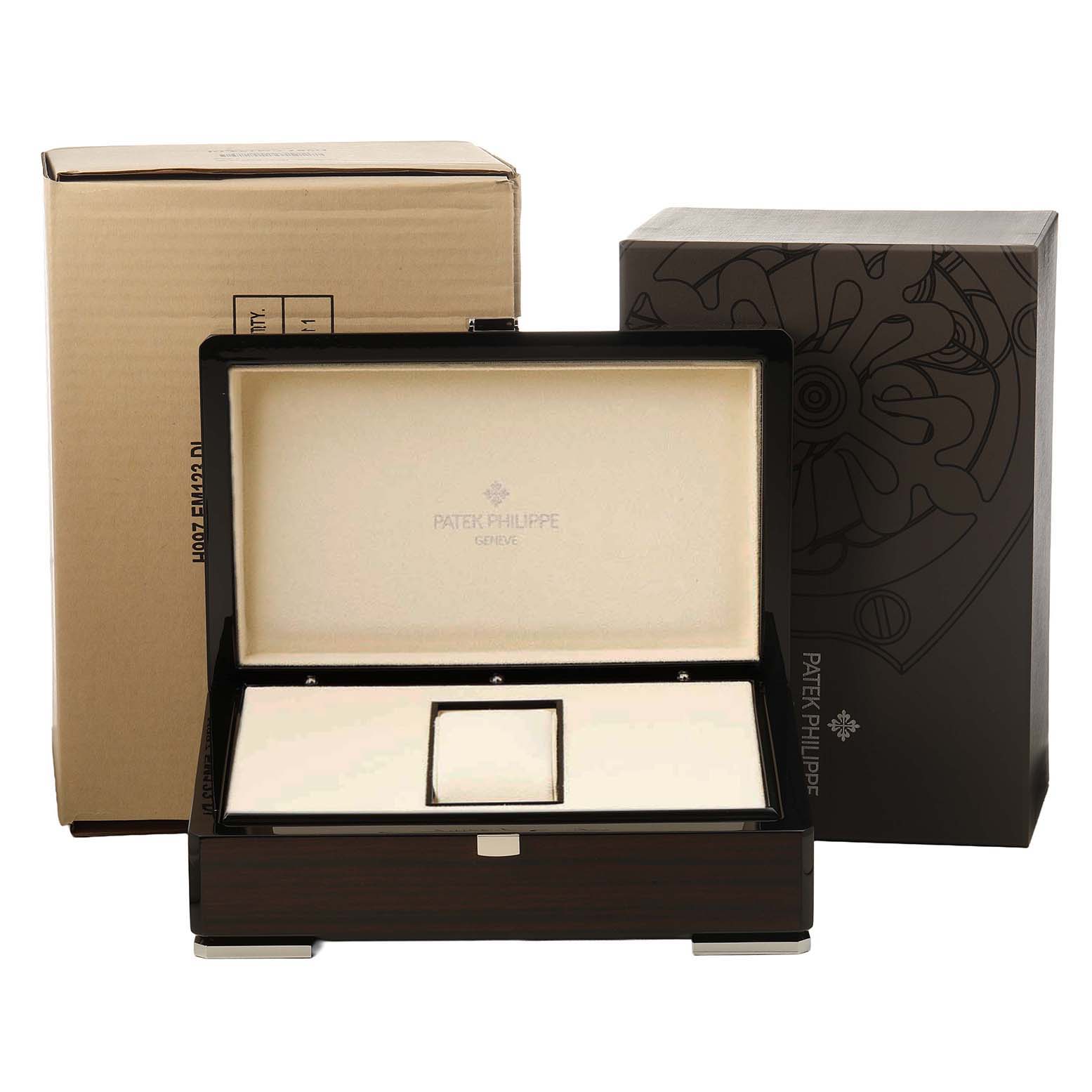 The image shows a Patek Philippe Aquanaut 5067A/011 Women's Stainless Steel White Dial watch box and packaging from a front angle, including inner and outer boxes.