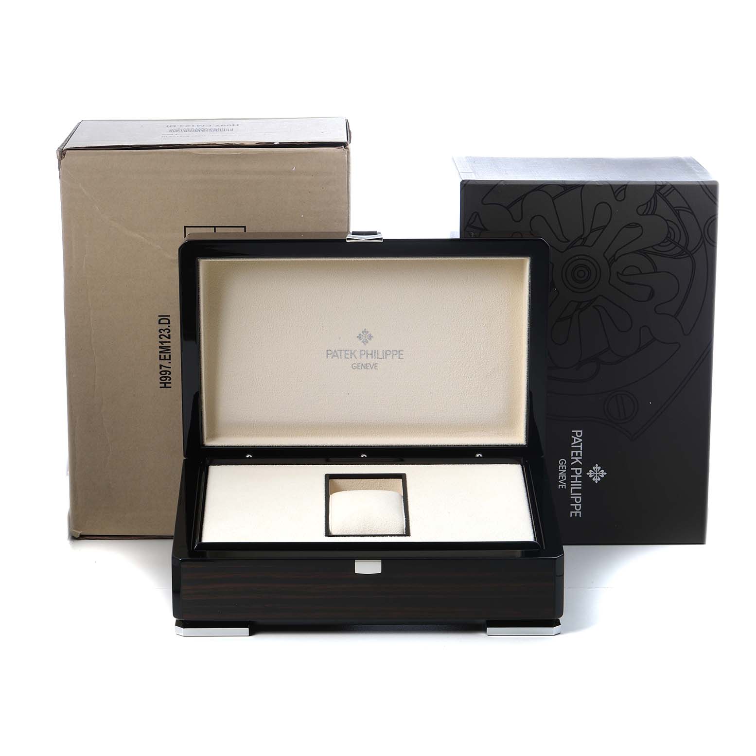 The image shows a Patek Philippe Complications 5172G-001 Men's White Gold Champagne Dial watch box with inner cushion and outer packaging.