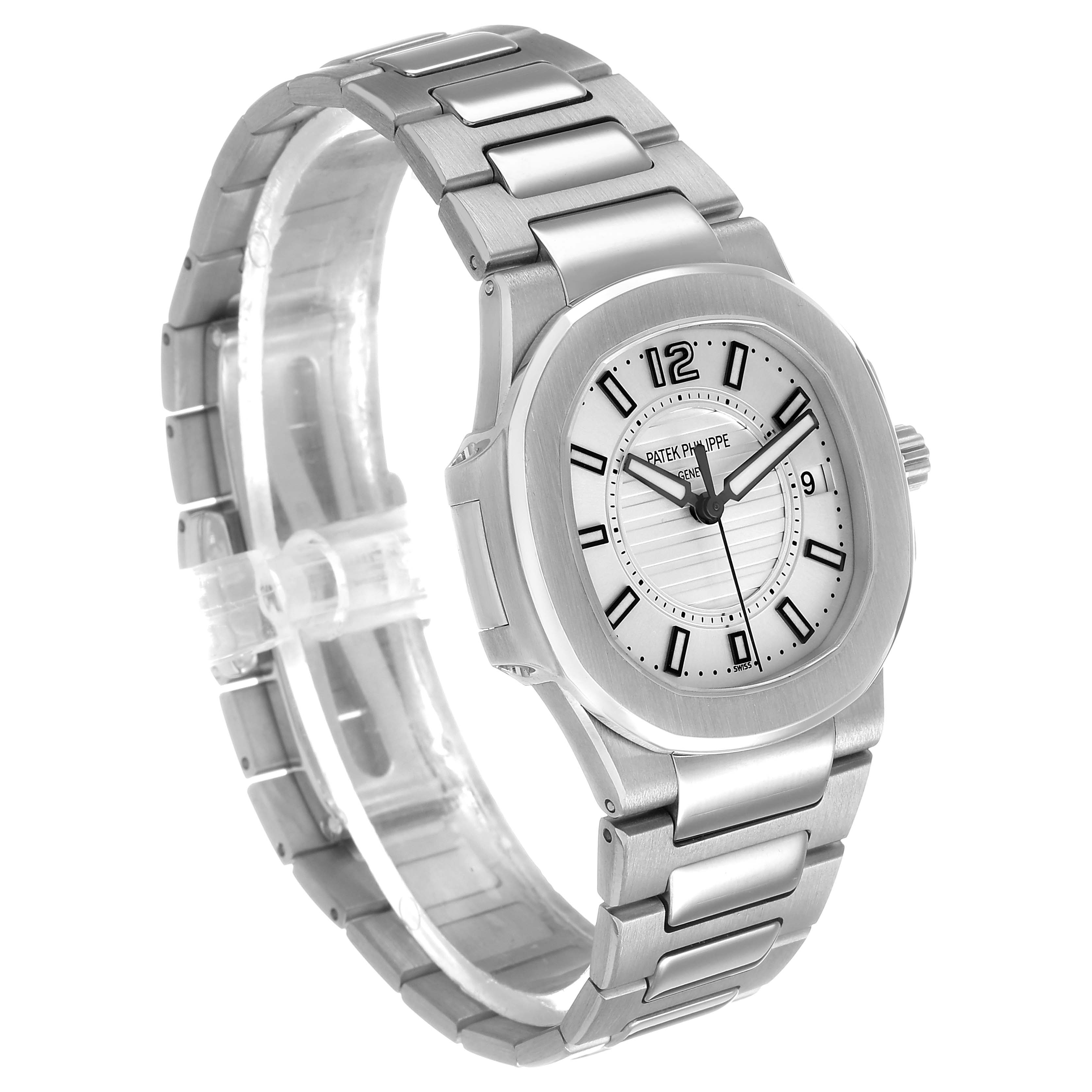 The Patek Philippe Nautilus 7011/1G-001 Women's White Gold Silver Dial watch is shown at a three-quarter angle, highlighting its face, bezel, and stainless steel bracelet.