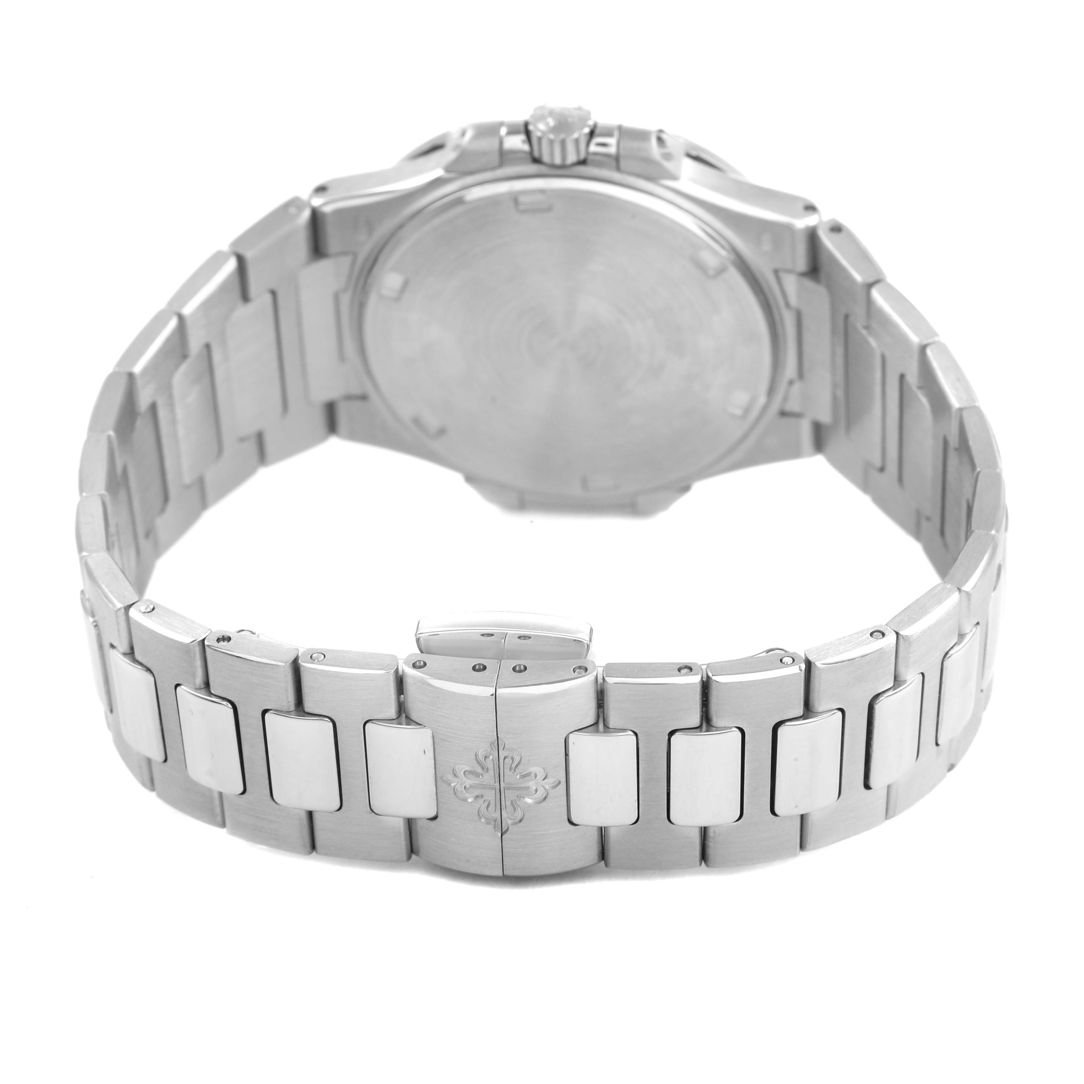 The image shows the back side of a Patek Philippe Nautilus 7011/1G-001 Women's White Gold Silver Dial watch, highlighting its bracelet and clasp.
