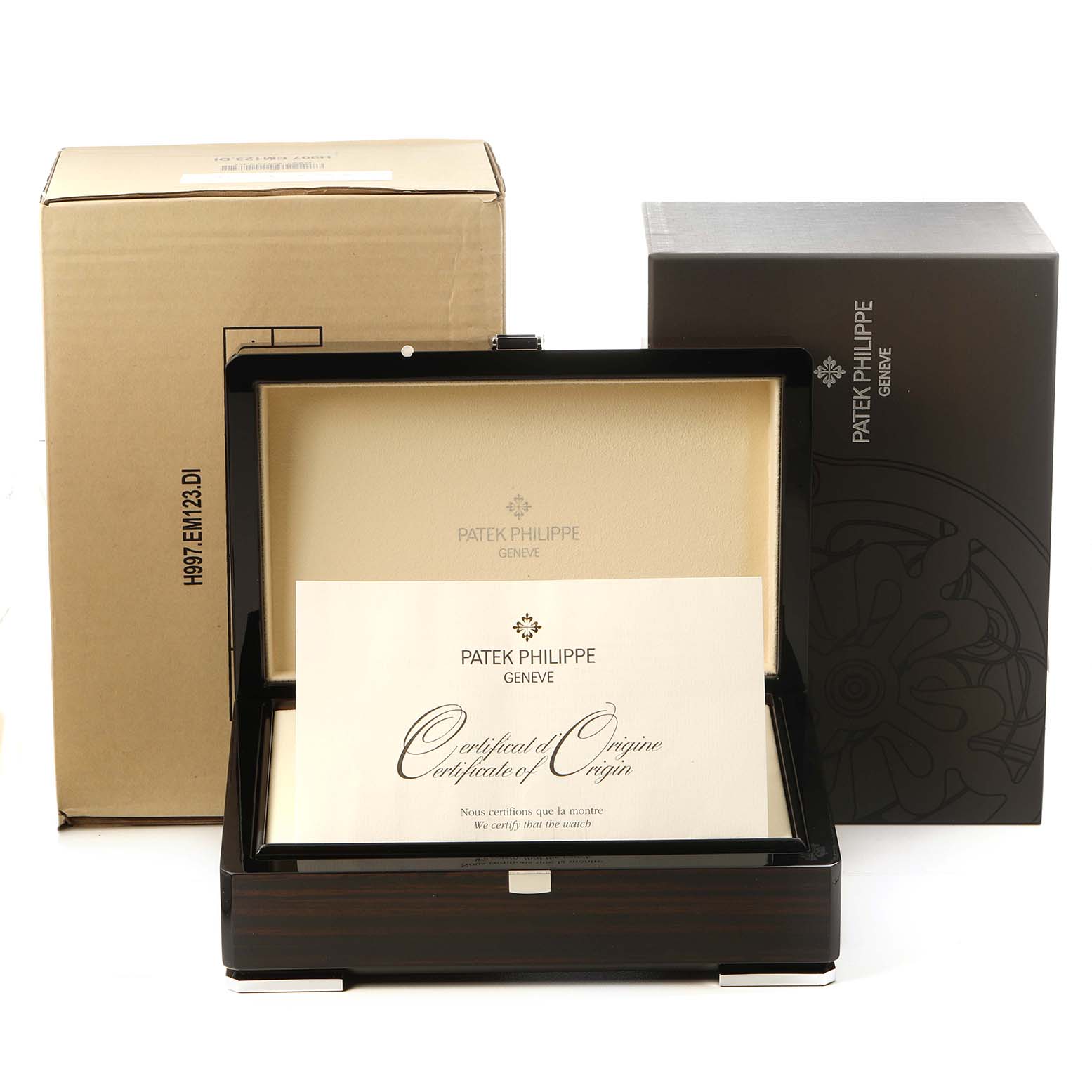 This image shows the packaging for a Patek Philippe Nautilus 7011/1G-001 Women's White Gold Silver Dial watch, including boxes and a Certificate of Origin.