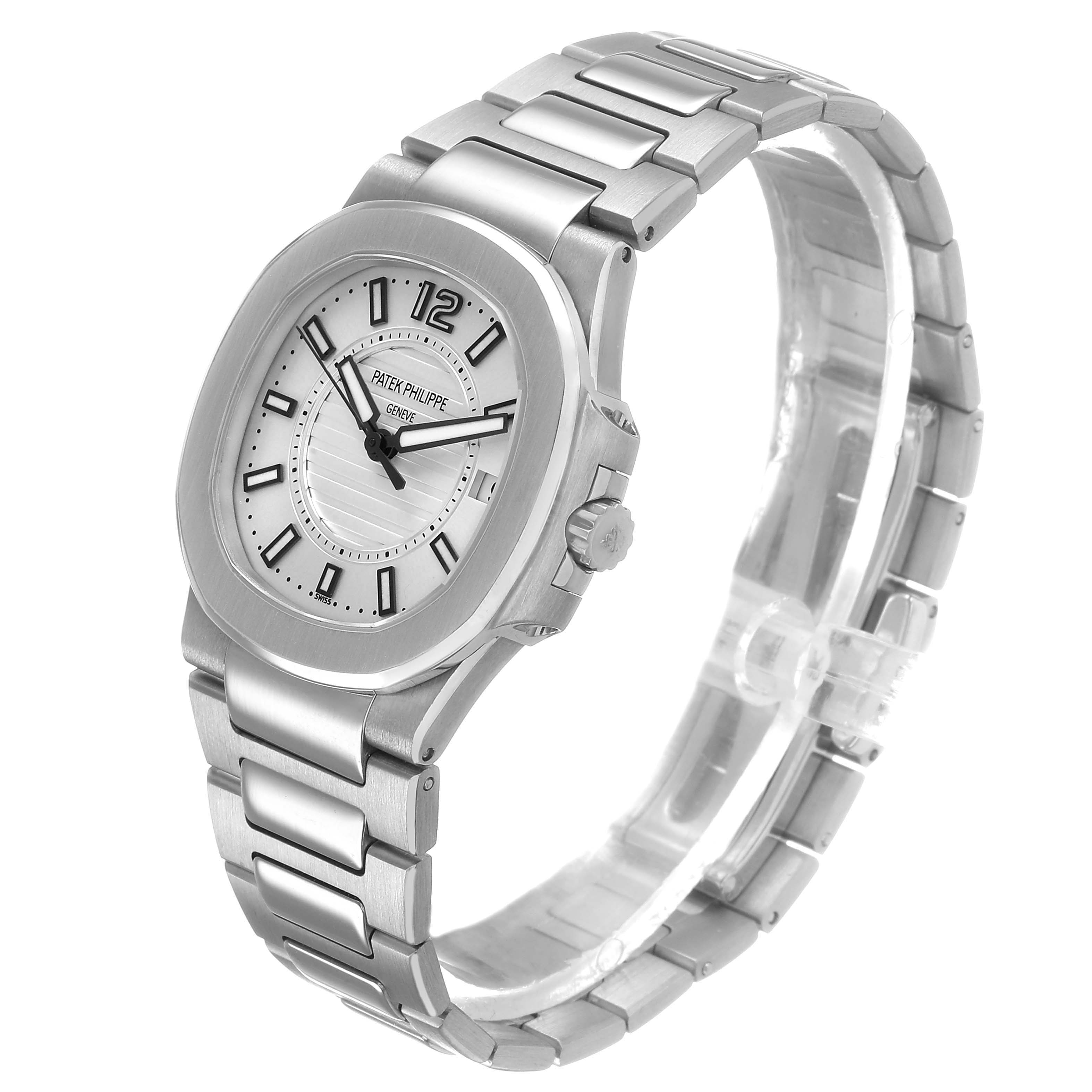 The Patek Philippe Nautilus 7011/1G-001 Women's White Gold Silver Dial watch is shown from a three-quarter angle, displaying the face, bracelet, and side profile.