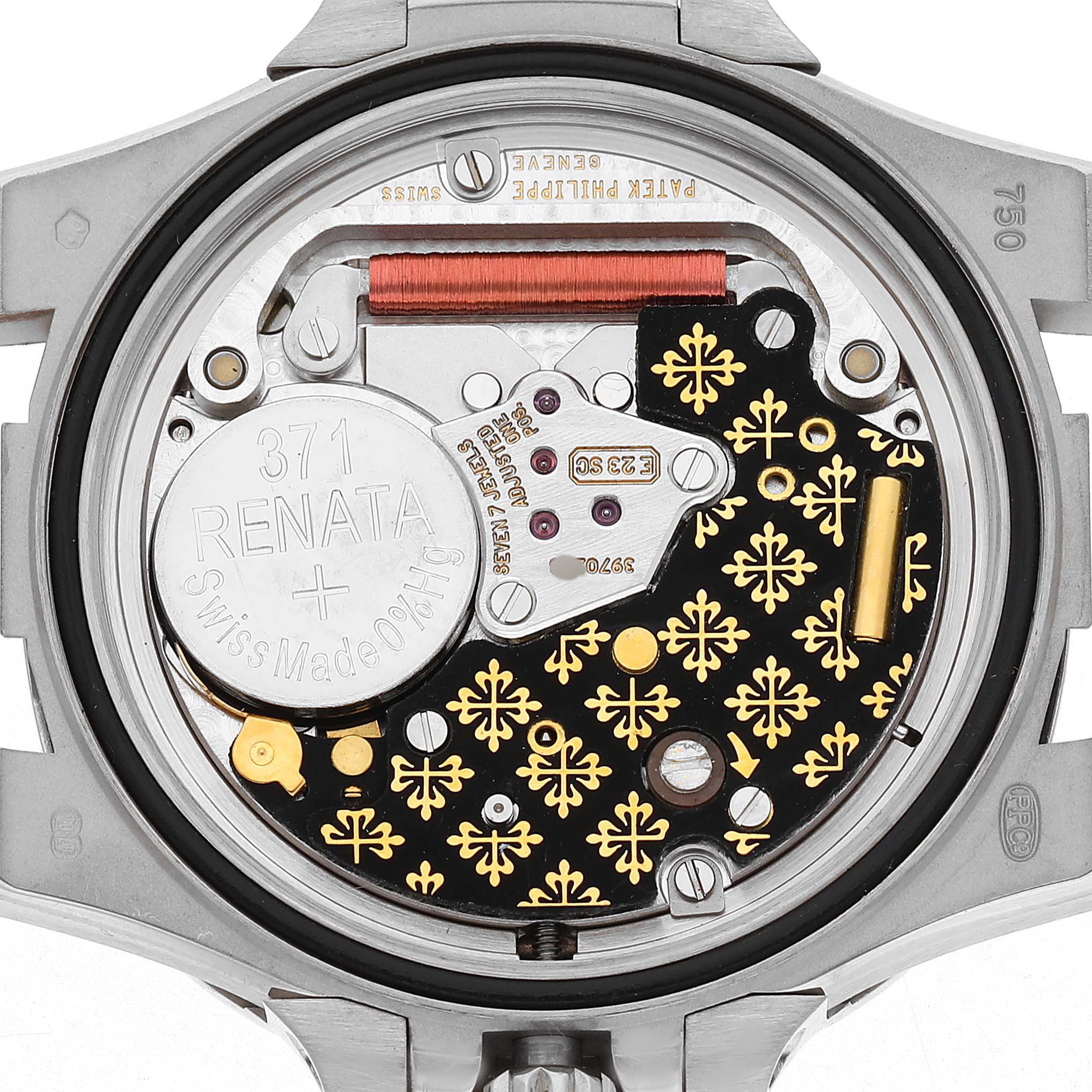 The image shows the movement from the back of a Patek Philippe Nautilus 7011/1G-001 Women's White Gold Silver Dial watch, highlighting the battery and intricate components.