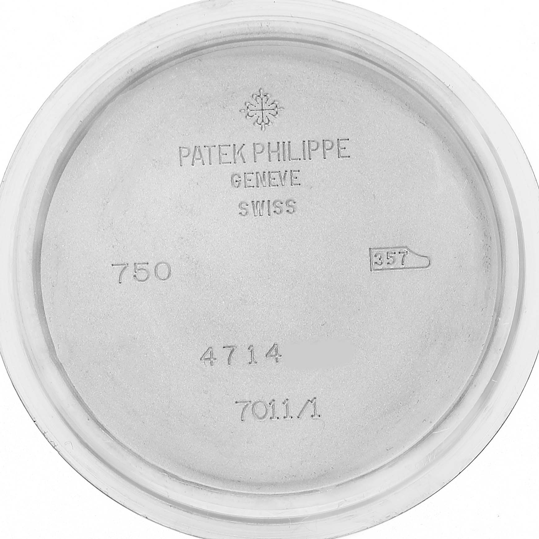 The image shows the inner side of the case back for a Nautilus model by Patek Philippe, featuring engraved details and markings.
