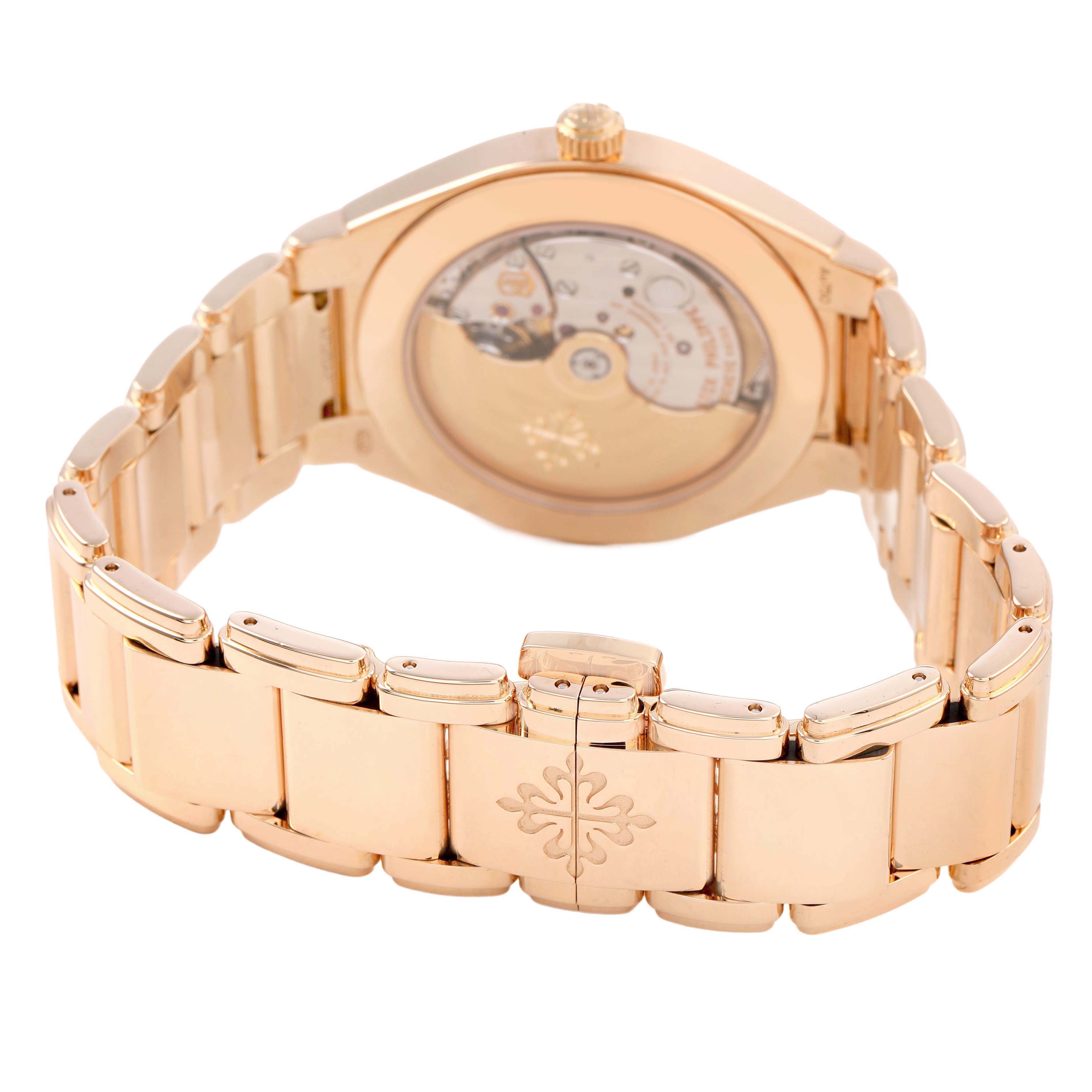 The image shows the back view of a Patek Philippe Twenty-4 7300/1200R-010 Women's Rose Gold Silver Dial model, highlighting the case back and bracelet clasp.