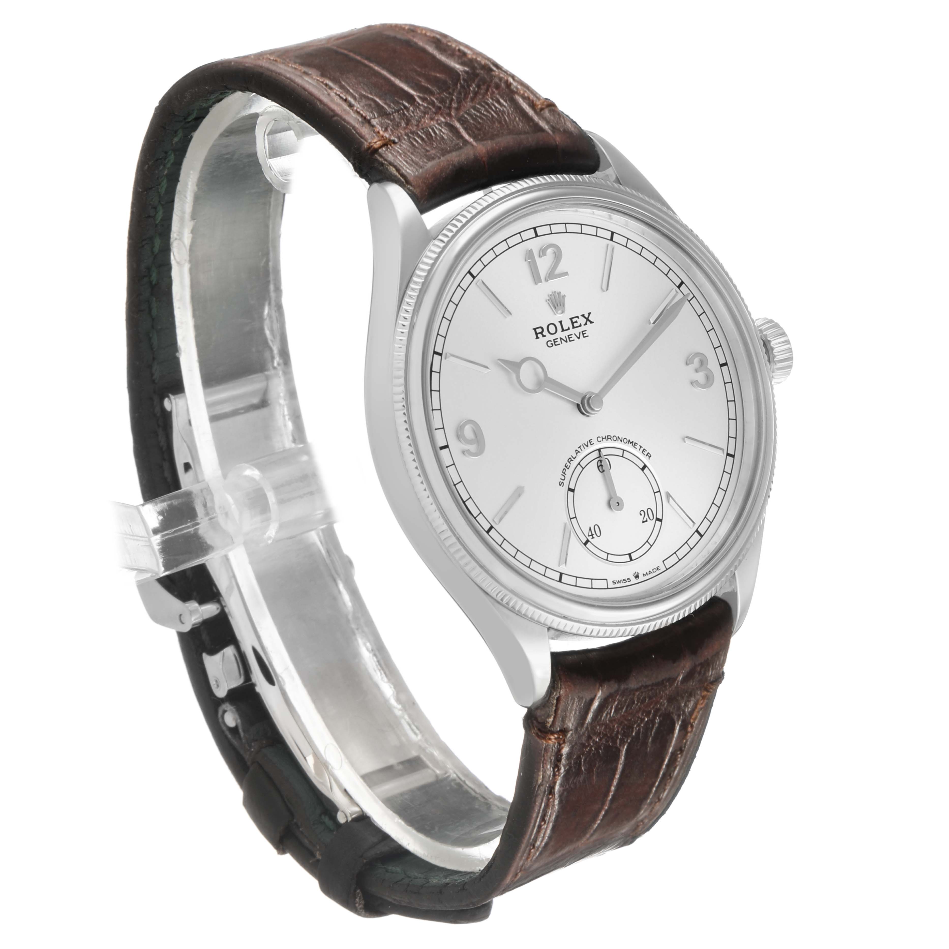 The Rolex Cellini 52509 Men's White Gold Silver Dial watch is shown at a three-quarter angle, displaying the dial, crown, and brown leather strap.