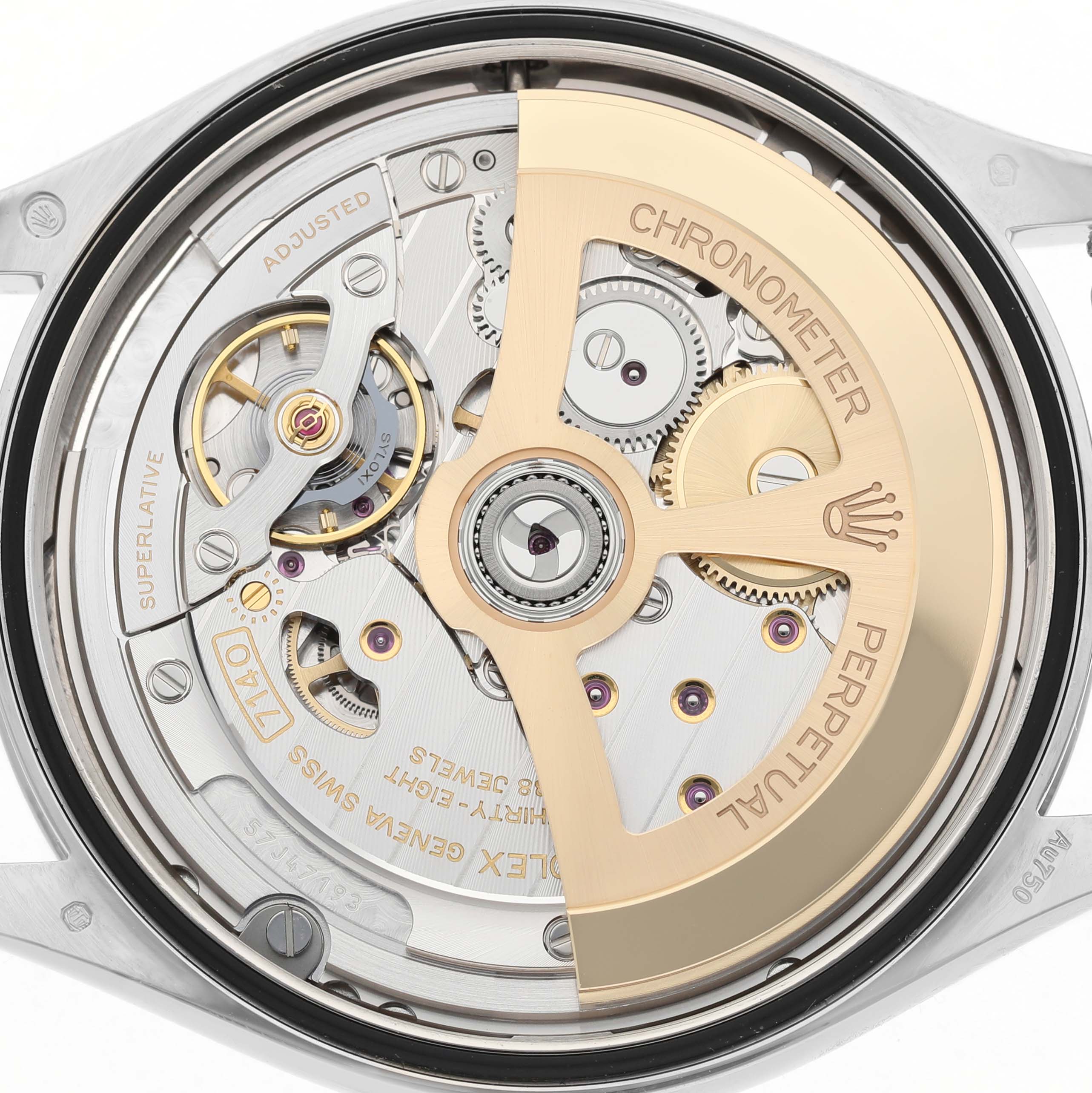 The image shows the inner movement of a Rolex Cellini 52509 Men's White Gold Silver Dial watch, highlighting the gears and and rotor from the back.