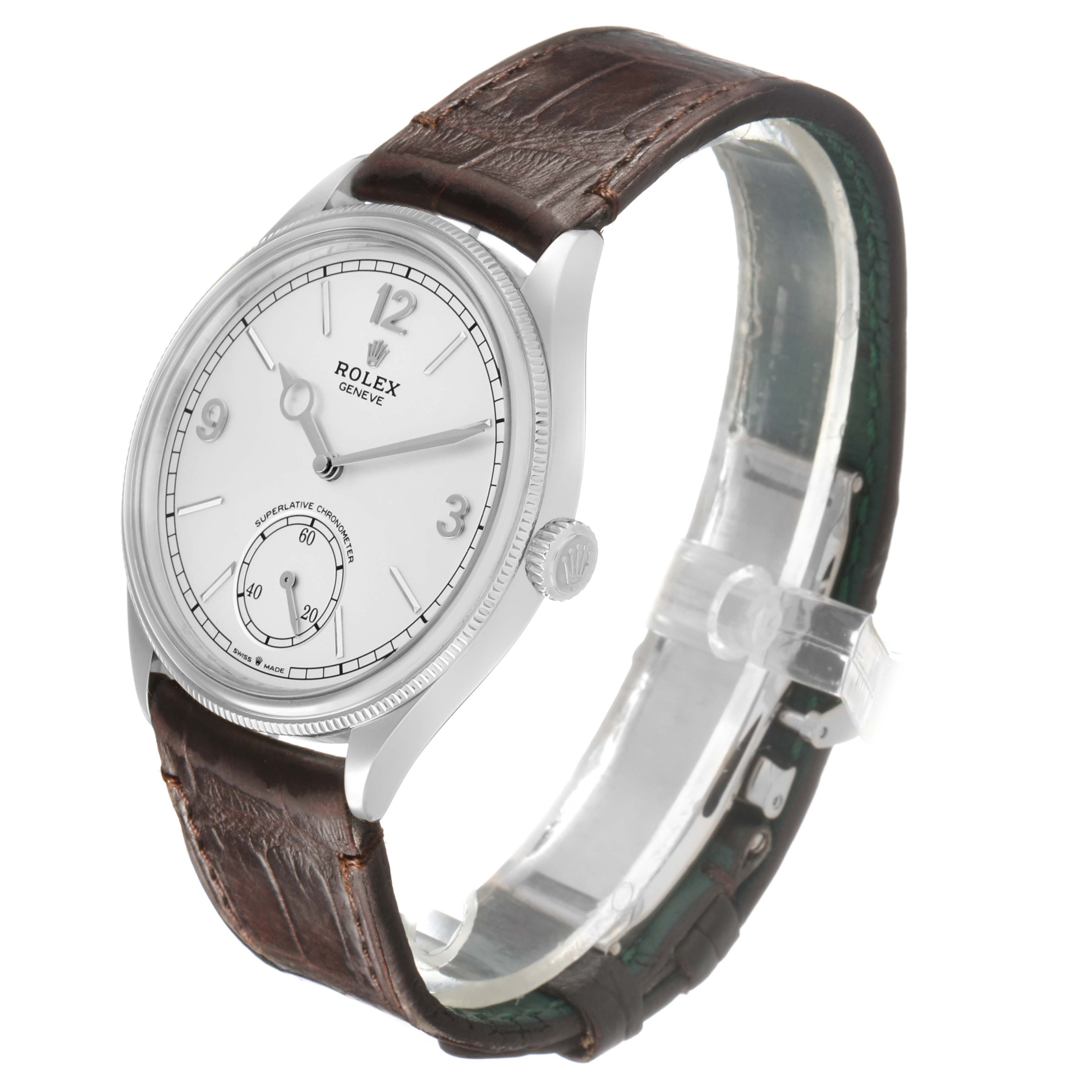 The Rolex Cellini 52509 Men's White Gold Silver Dial watch is shown at an angled side view, highlighting its dial, crown, and brown leather strap.