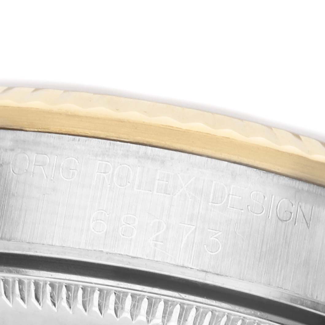 This image shows a close-up of the side of the Rolex Datejust 68273 Women's Steel and Gold (two tone) White Dial, displaying the model number and part of the bezel.