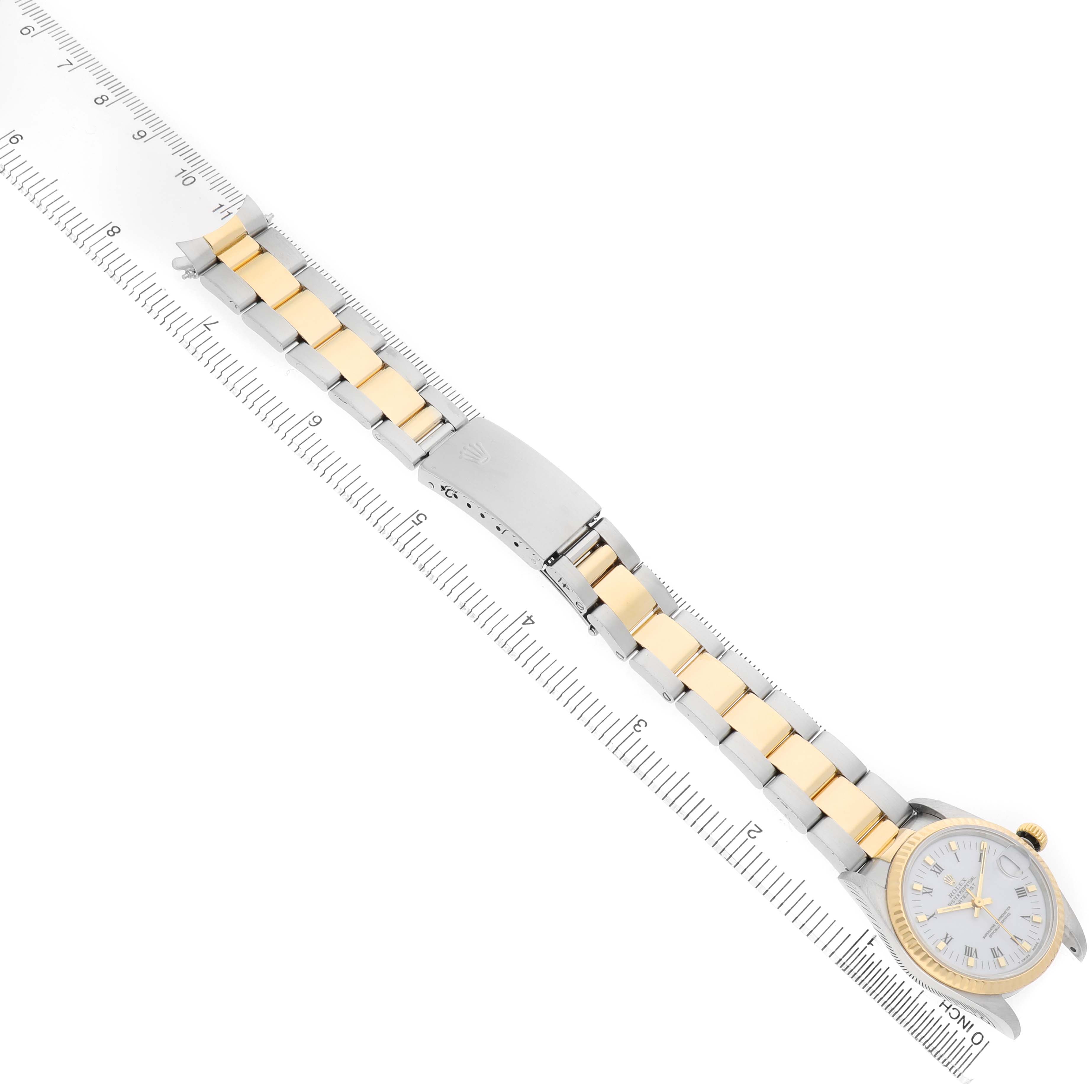 The Rolex Datejust 68273 Women's Steel and Gold (two tone) White Dial watch is shown from an angled top view, featuring its face, crown, and two-tone bracelet with clasp.