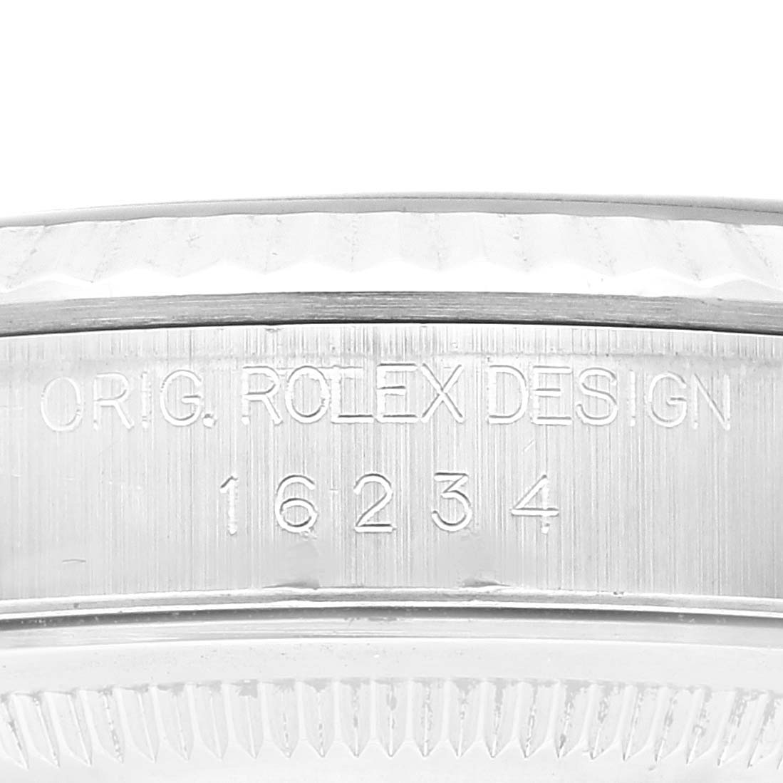 This image shows a close-up of the model number engraving on the case side of a Rolex Datejust 16234 Men's Stainless Steel Blue Dial 16234 Men's Stainless Steel Blue Dial watch.