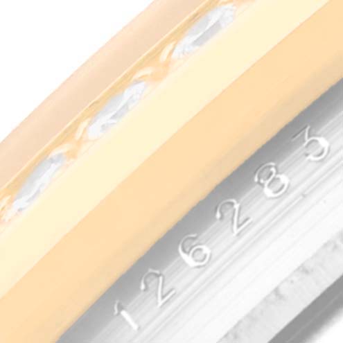 The image shows a close-up of the serial number and part of the bezel of a Rolex Datejust 126283 Men's Steel and Gold (two tone) Silver Dial 126283 Men's Steel and Gold (two tone) Silver Dial watch.