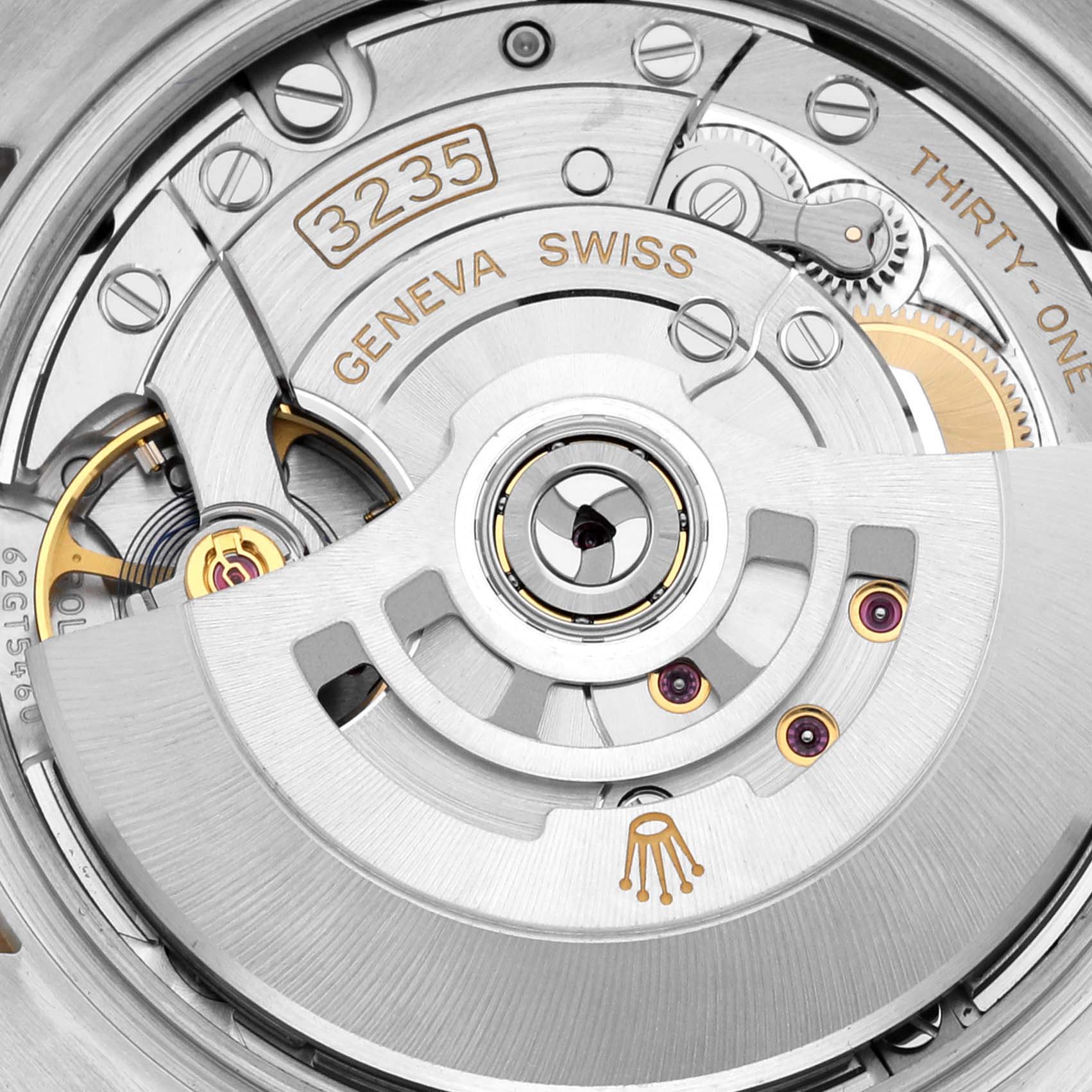 The image shows the intricate back view of a Rolex Datejust 126283 Men's Steel and Gold (two tone) Silver Dial 126283 Men's Steel and Gold (two tone) Silver Dial movement, highlighting the rotor, gears, and engraving details.