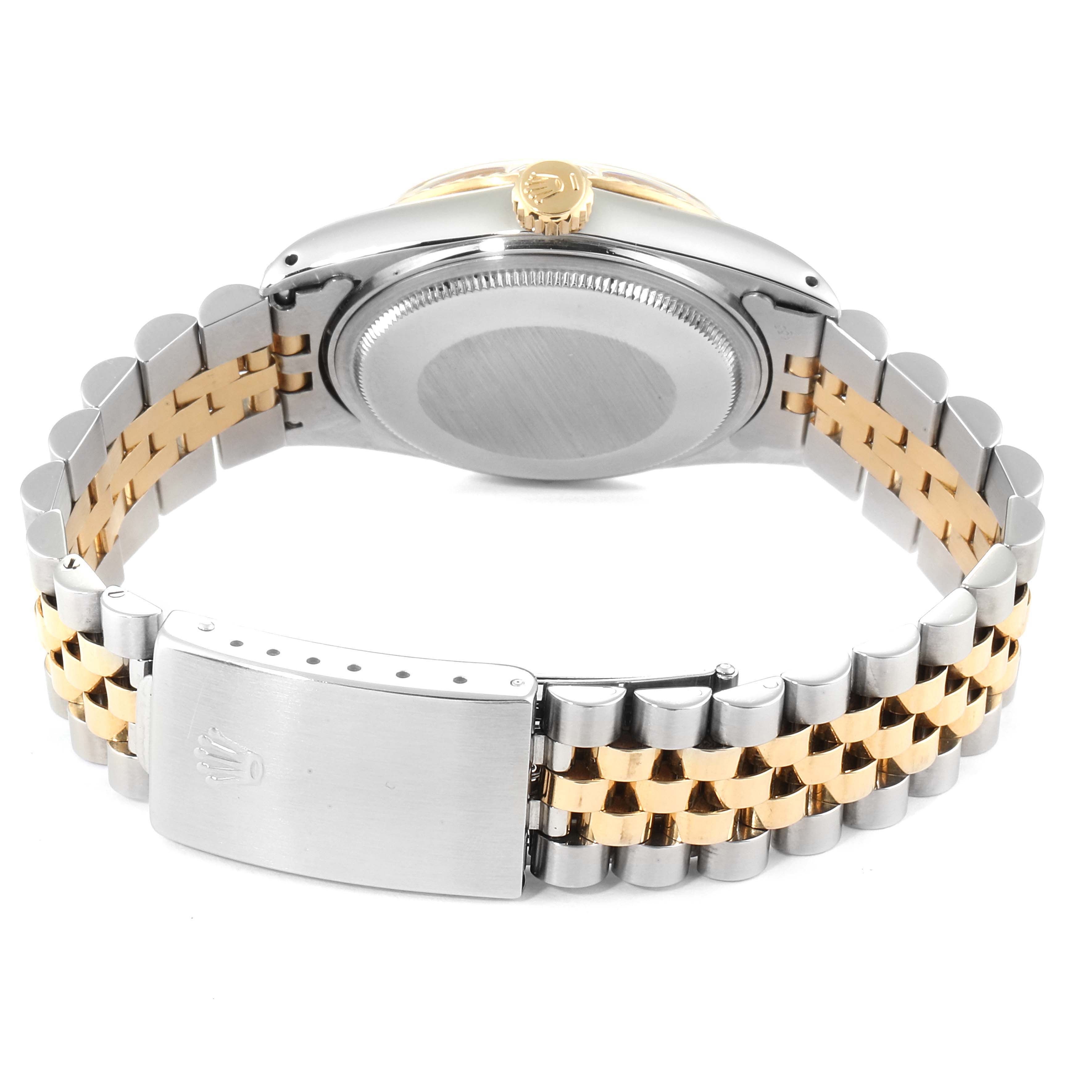 The image shows the back of a Vintage Collection Rolex watch with a two-tone metal bracelet and clasp.