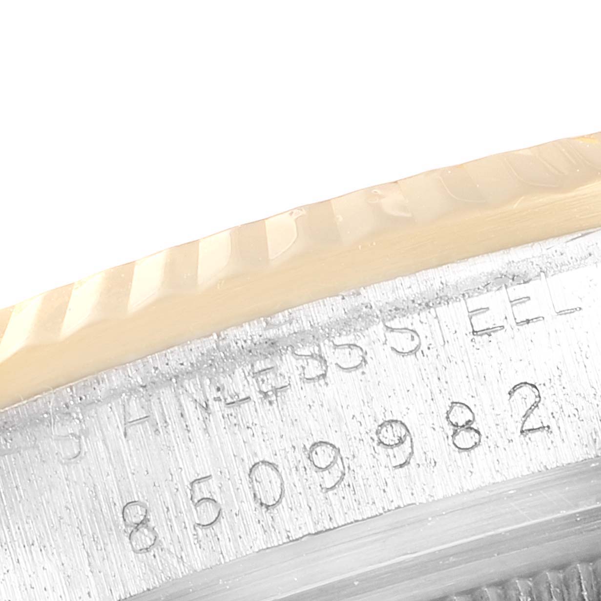 This image shows a close-up of the serial number engraving and bezel of the Rolex Vintage Collection 16013 Men's Steel and Gold (two tone) Champagne Dial 16013 Men's Steel and Gold (two tone) Champagne Dial watch.