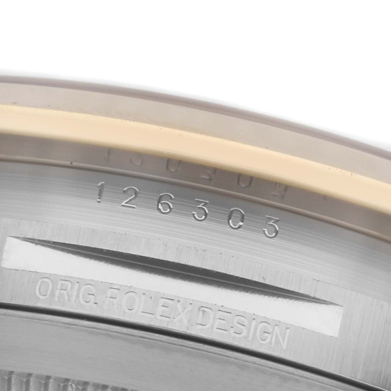 The image shows a detailed close-up of the inner case edge with serial and design engravings of a Rolex Datejust 41 126303 Men
s Steel and Gold (two tone) Silver Dial 126303 Men
s Steel and Gold (two tone) Silver Dial.