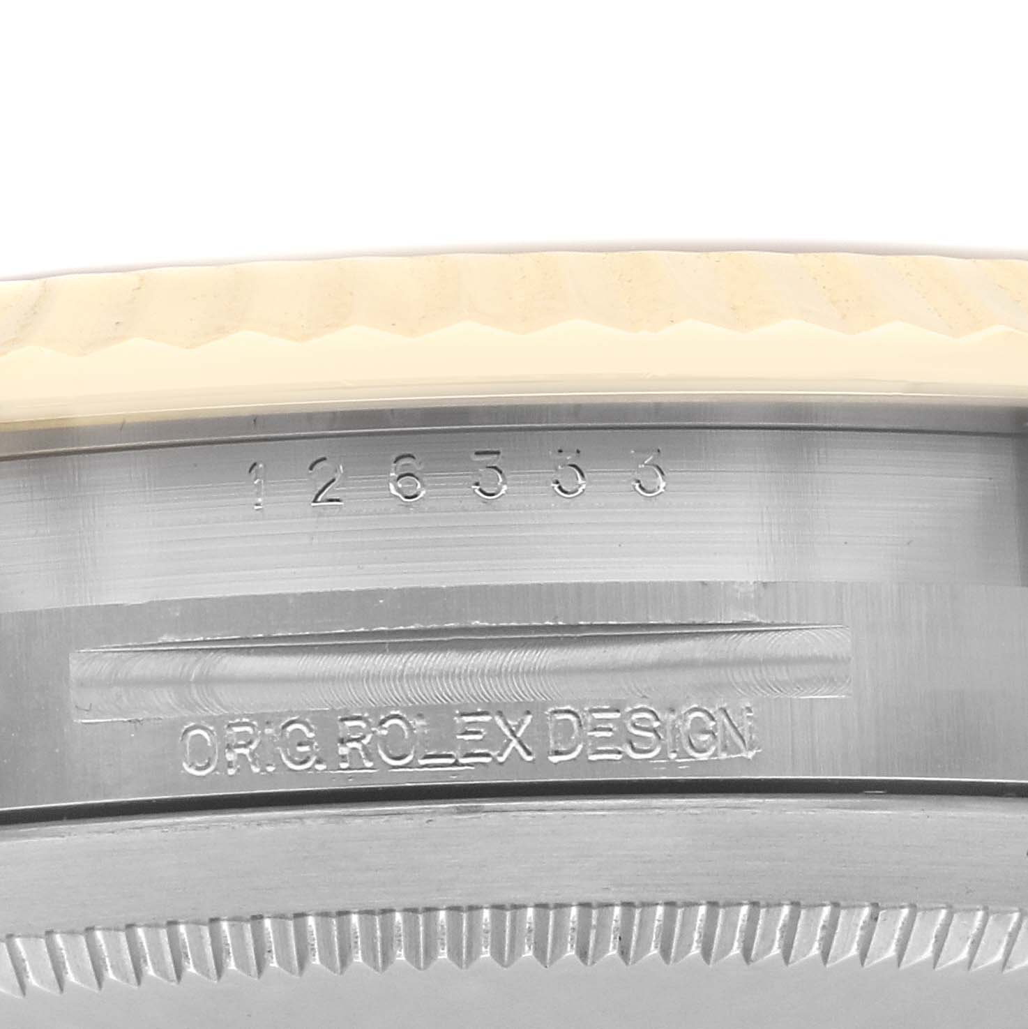The image shows a close-up of the case back and serial number of a Rolex Datejust 41 126333 Men
s Steel and Gold (two tone) Silver Dial 126333 Men
s Steel and Gold (two tone) Silver Dial watch.