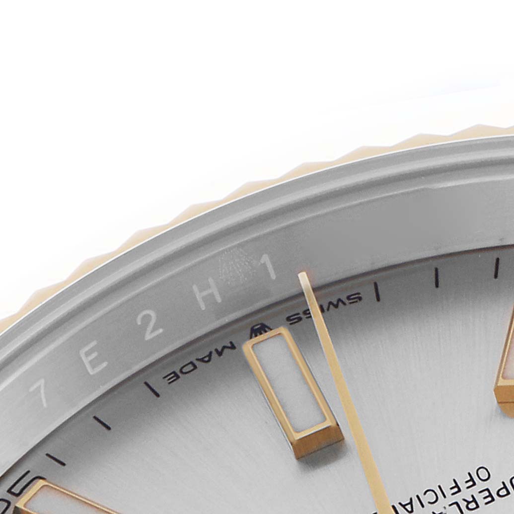 The image shows a close-up of the Rolex Datejust 41 126333 Men
s Steel and Gold (two tone) Silver Dial 126333 Men
s Steel and Gold (two tone) Silver Dial watch face, highlighting part of the dial, bezel, and hour markers.