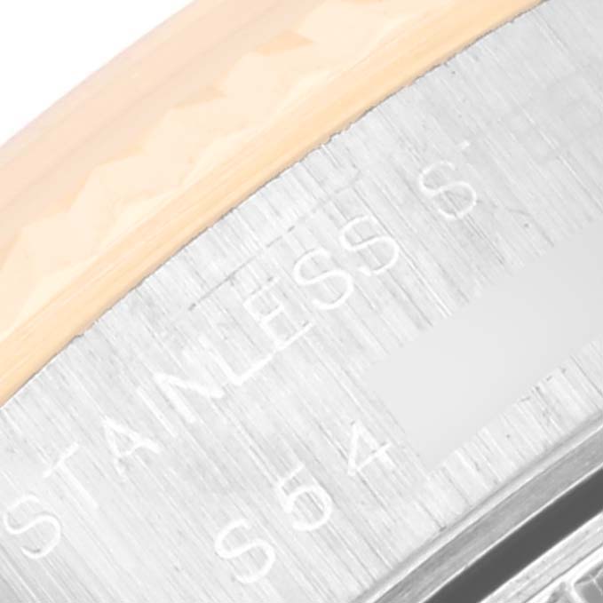The image shows a close-up of the edge and case back of the Rolex Datejust 69173 Women's Steel and Gold (two tone) White Dial 69173 Women's Steel and Gold (two tone) White Dial watch with part of the text "STAINLESS" visible.