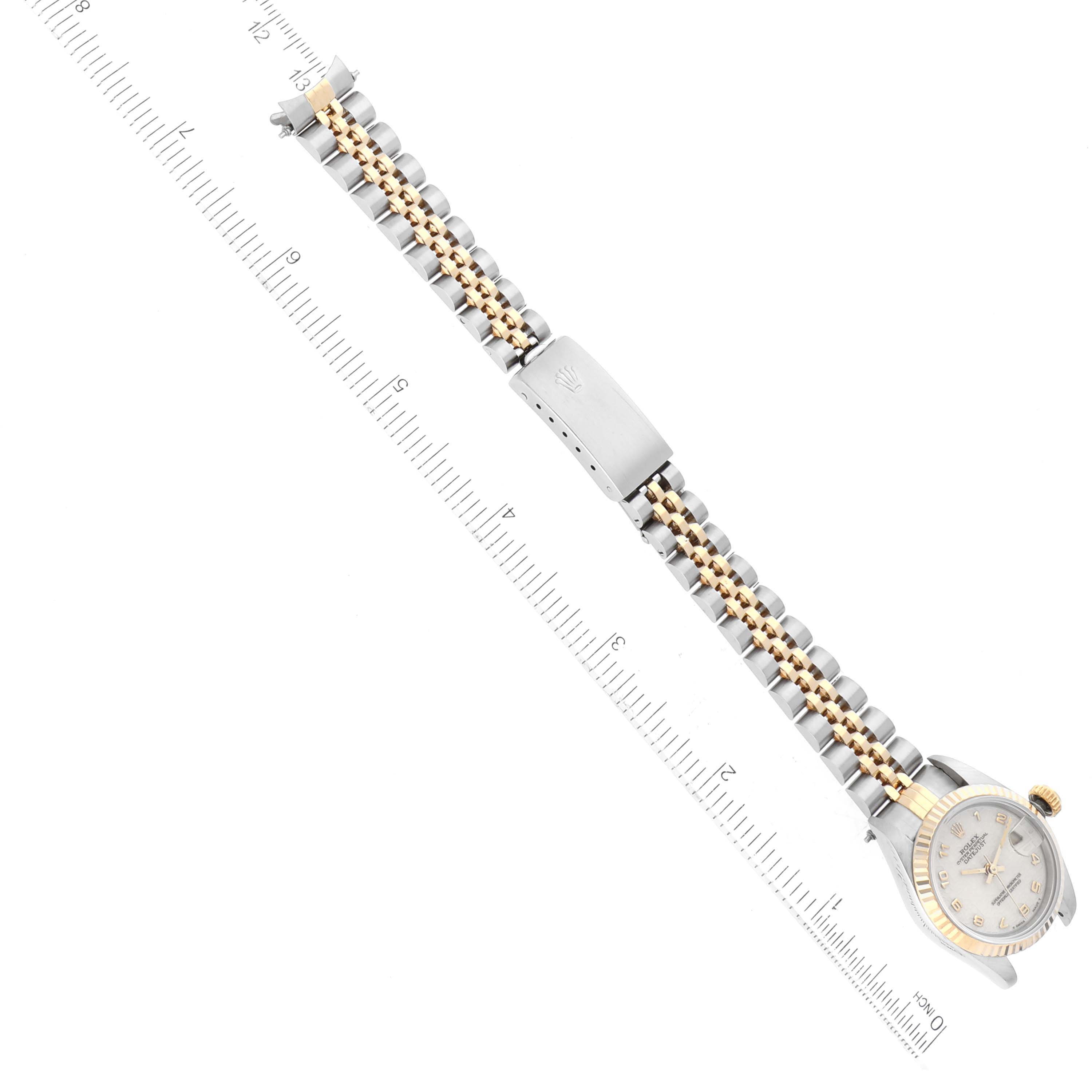 The image shows a Rolex Datejust 69173 Women's Steel and Gold (two tone) White Dial 69173 Women's Steel and Gold (two tone) White Dial watch at an overhead angle, highlighting the bracelet, clasp, case, and crown.