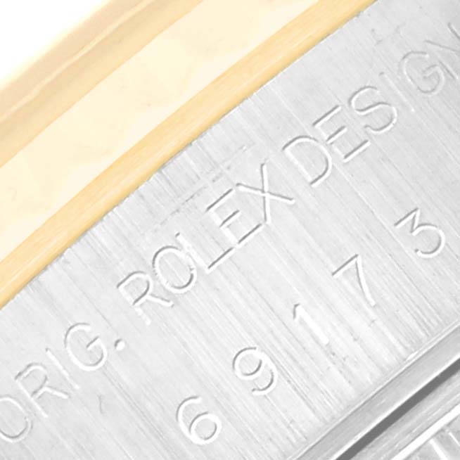 This close-up image shows the side engraving of a Rolex Datejust 69173 Women's Steel and Gold (two tone) Champagne Dial 69173 Women's Steel and Gold (two tone) Champagne Dial watch case, highlighting the model and brand inscription.