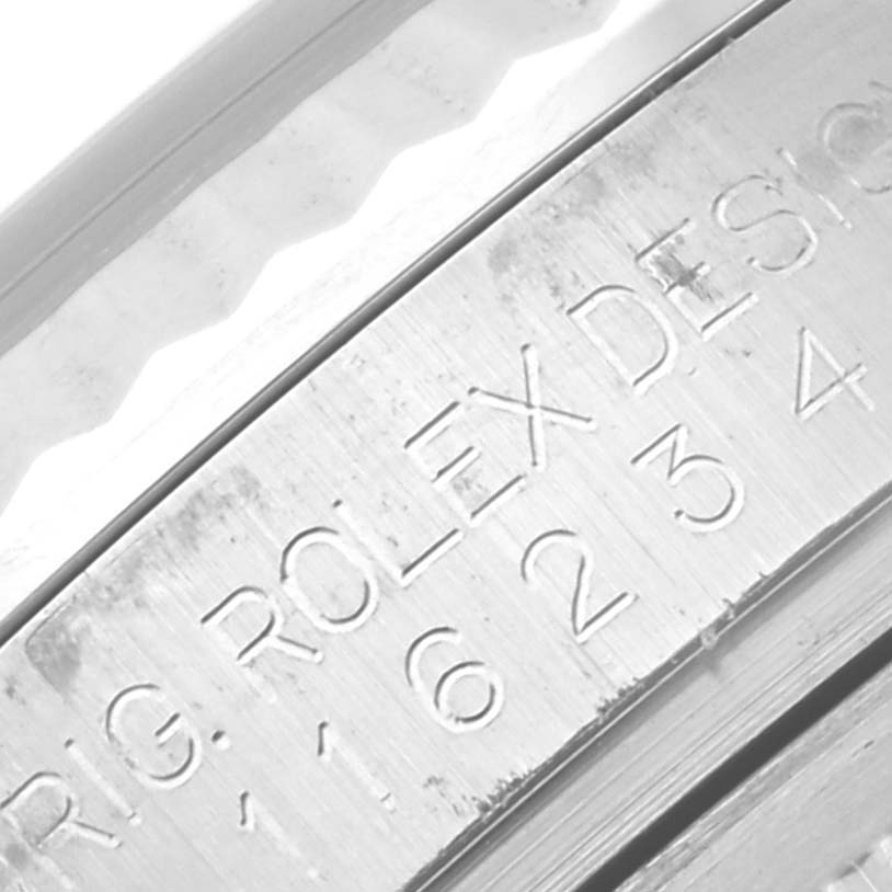 The image shows an angled close-up of the inner bezel and serial number engraving on a Rolex Datejust 116234 Men's Stainless Steel Black Dial 116234 Men's Stainless Steel Black Dial watch.