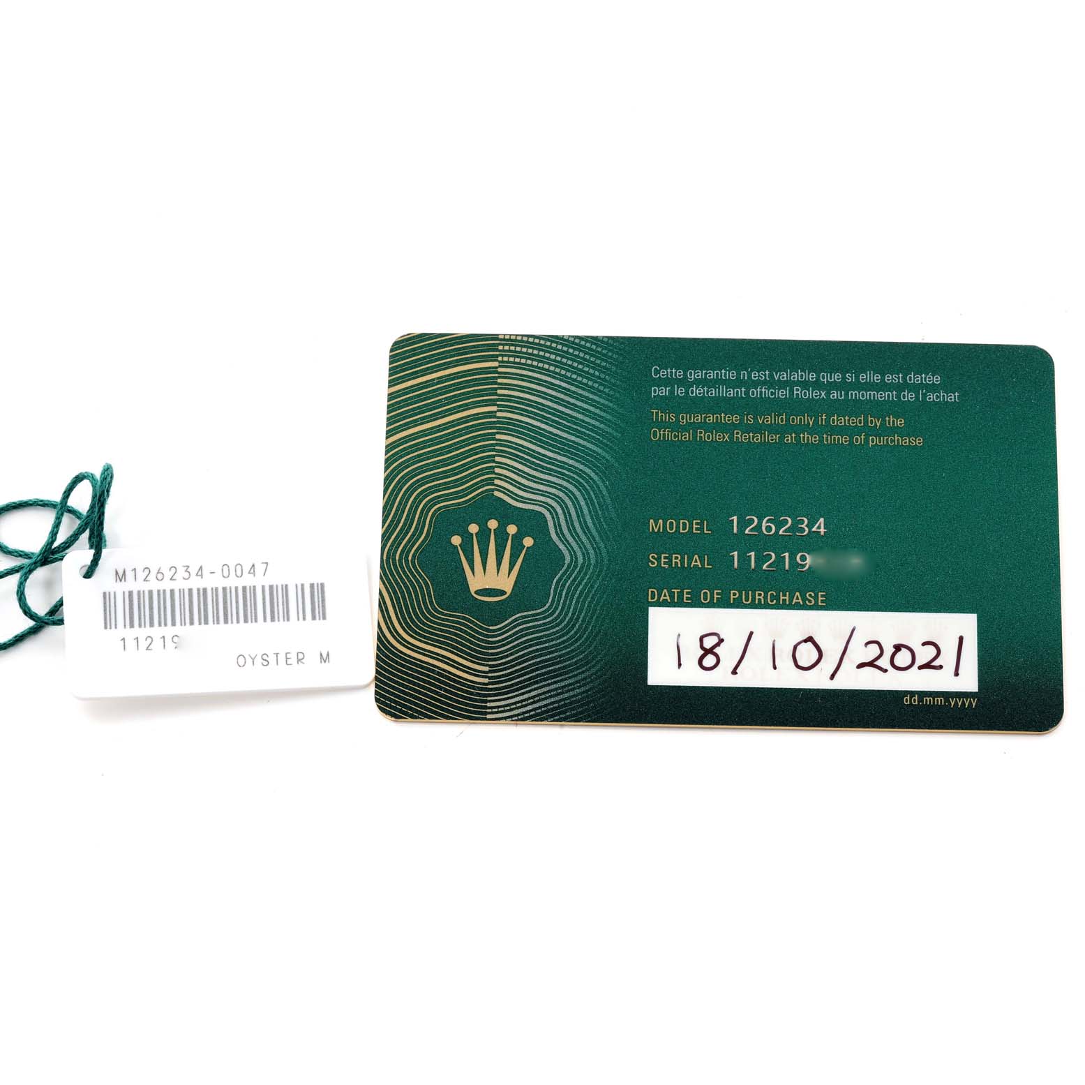 The image shows a Rolex Datejust 126234 Men's Stainless Steel Green Dial 126234 Men's Stainless Steel Green Dial model 126234 warranty card and a separate tag displaying the model and serial number.