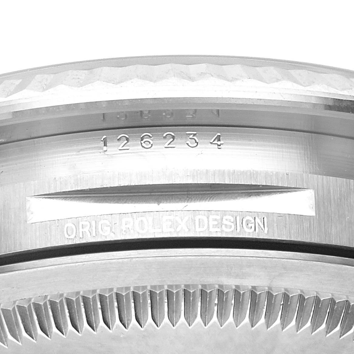This image shows a close-up of the side view of the bezel and case of a Rolex Datejust 126234 Men's Stainless Steel Green Dial 126234 Men's Stainless Steel Green Dial watch.