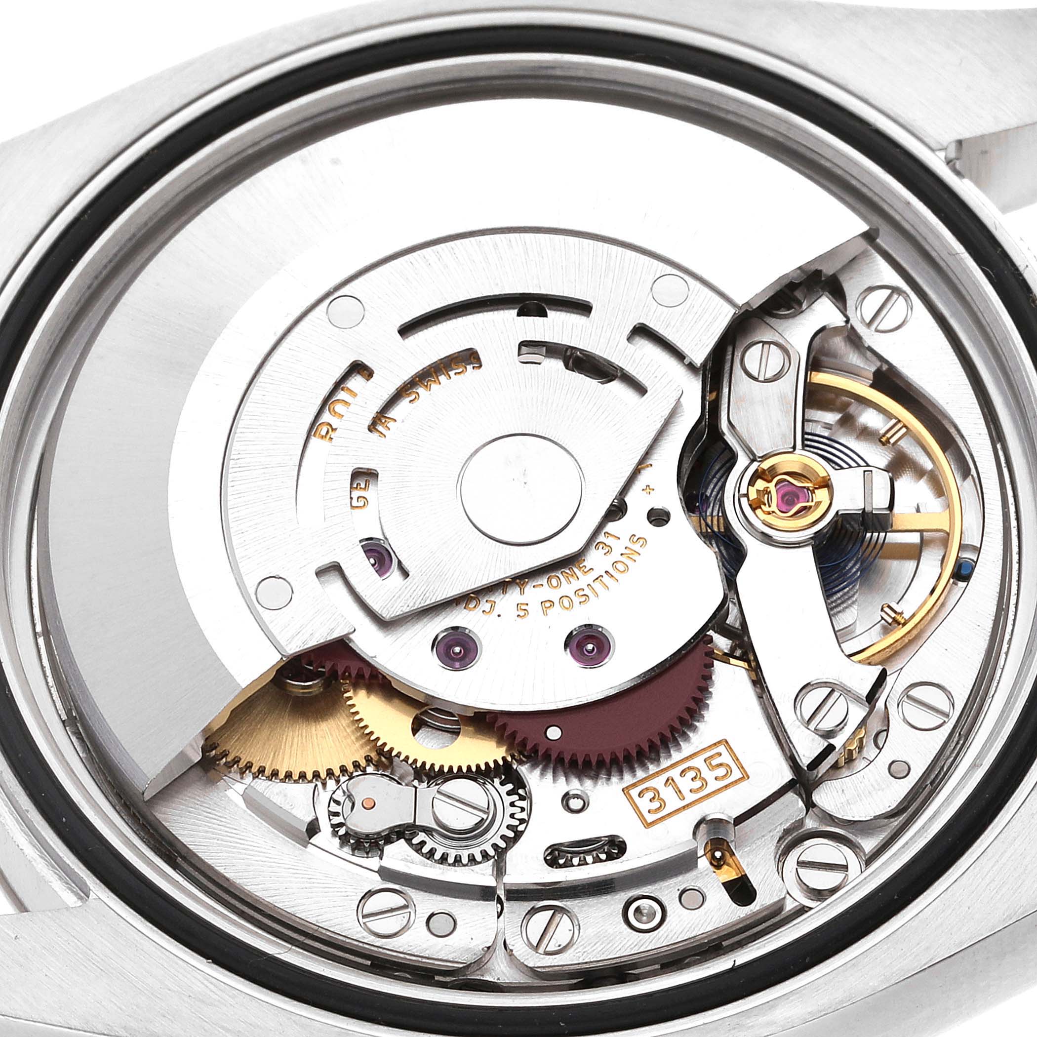 The image shows the internal mechanism of a Rolex Datejust 116234 Men's Stainless Steel Silver Dial 116234 Men's Stainless Steel Silver Dial watch, highlighting its intricate movement parts.